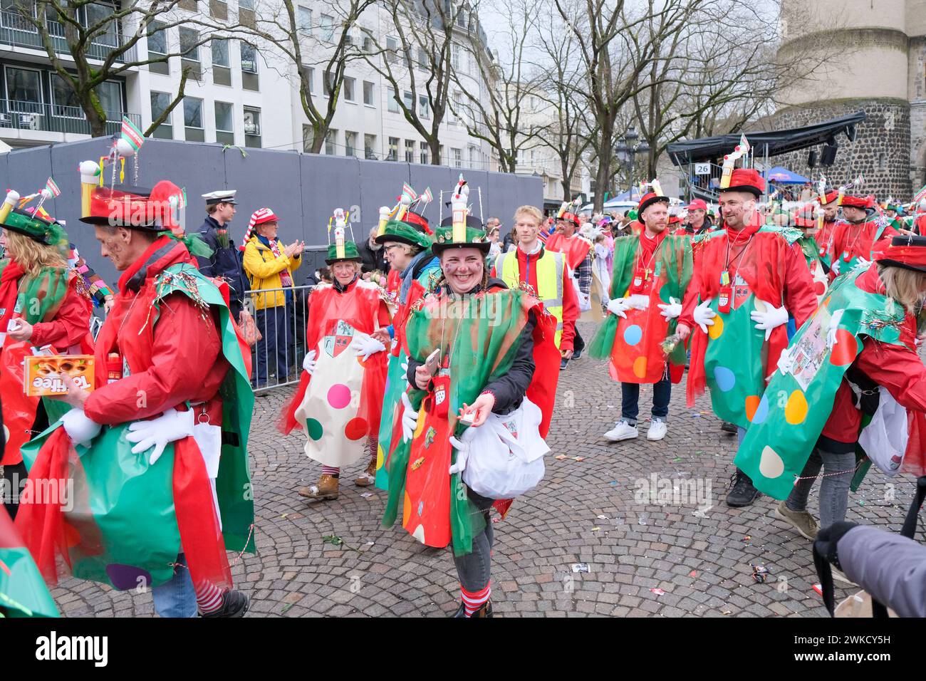 Cologne, Germany - February 11, 2024  Funny Street musicians in colorful clothes celebrating the women's carnival, Rosenmontag Parade( the rose monday. Stock Photo