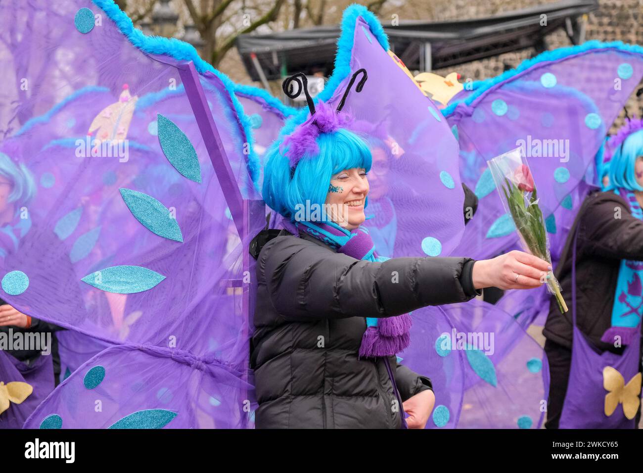Cologne, Germany - February 11, 2024  Funny Street musicians in colorful clothes celebrating the women's carnival, Rosenmontag Parade( the rose monday. Stock Photo
