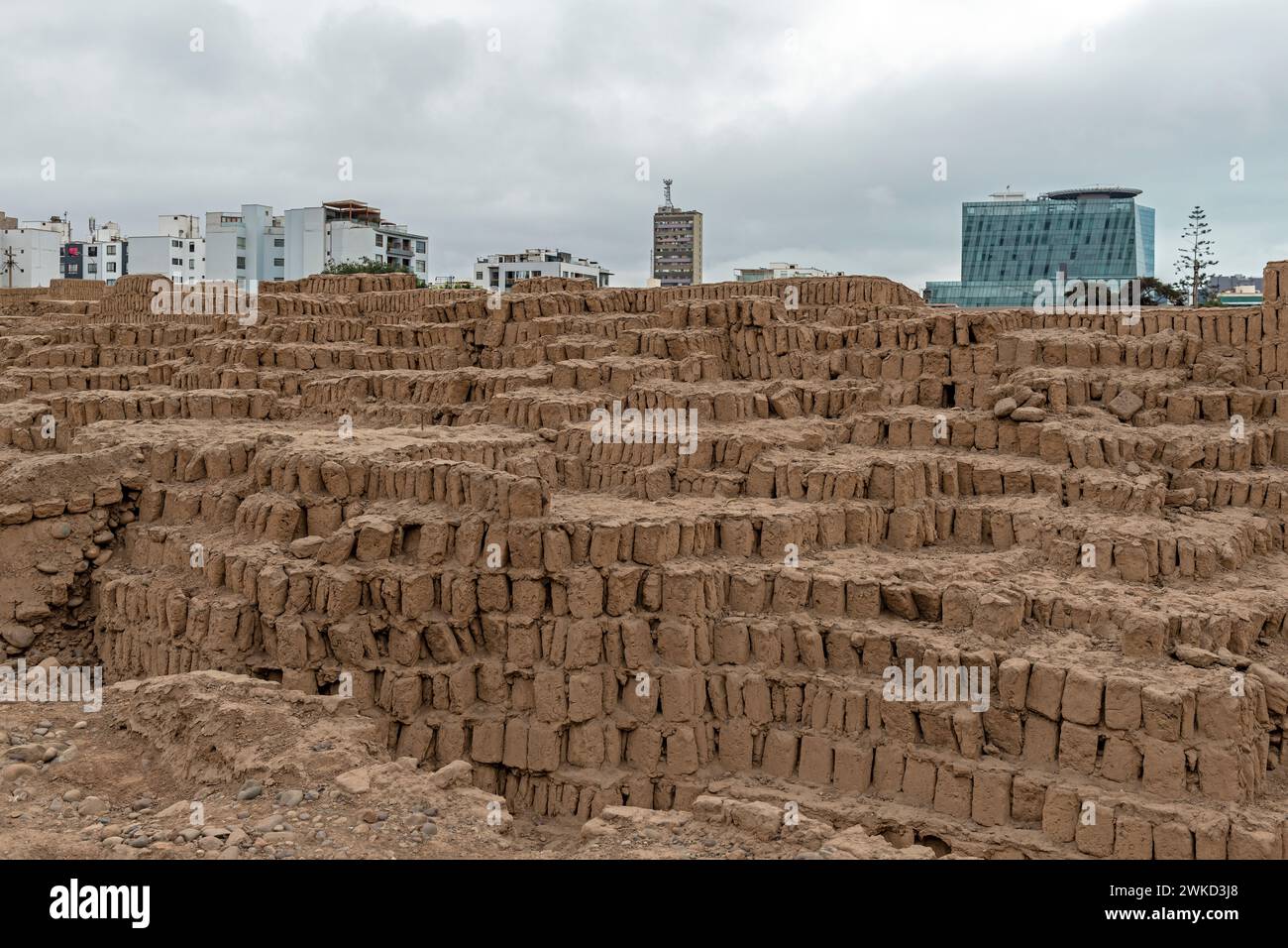 The Huaca Pucllana adobe and clay step pyramid of the Lima culture with buildings and cityscape of the Miraflores district, Lima, Peru. Stock Photo