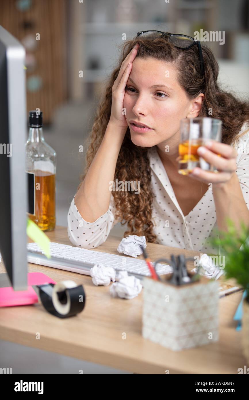 young drunk woman in office concept of alcoholism Stock Photo - Alamy