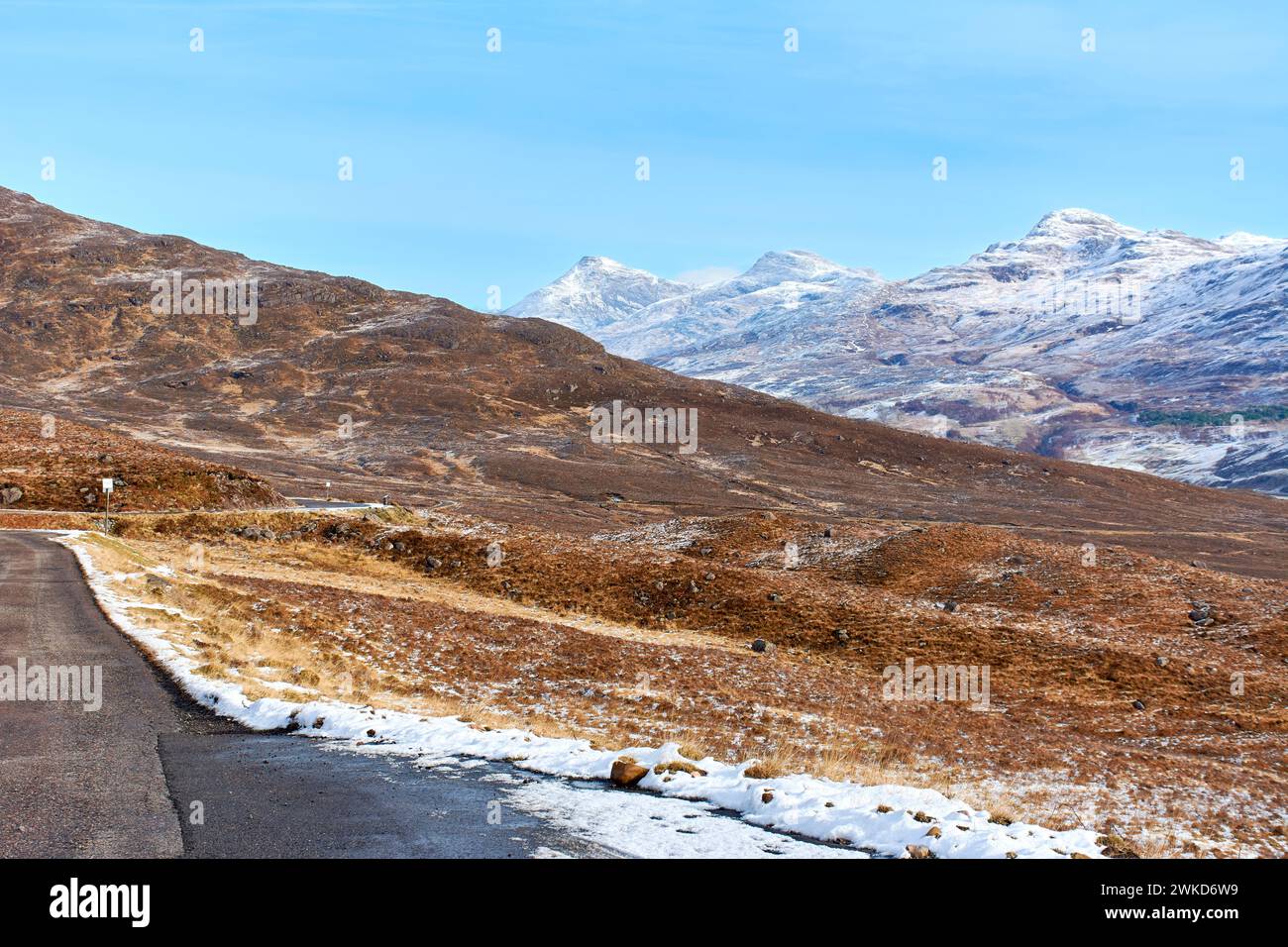 Applecross peninsular Scotland Bealach na Bà looking back down the road towards mountains in winter Stock Photo