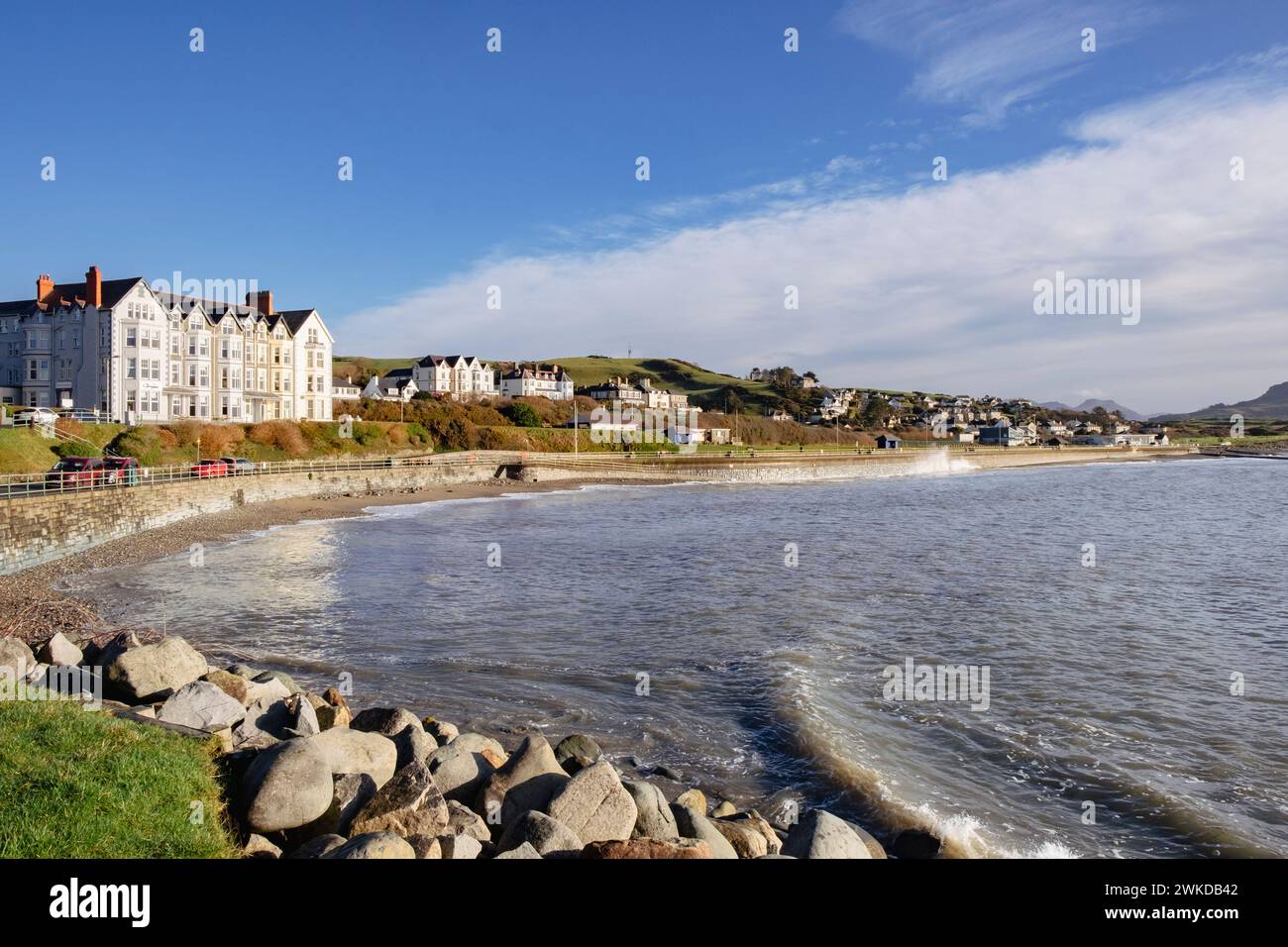 View along the seafront at high tide on the Welsh west coast. Criccieth, Llyn Peninsula, Gwynedd, north Wales, UK, Britain Stock Photo