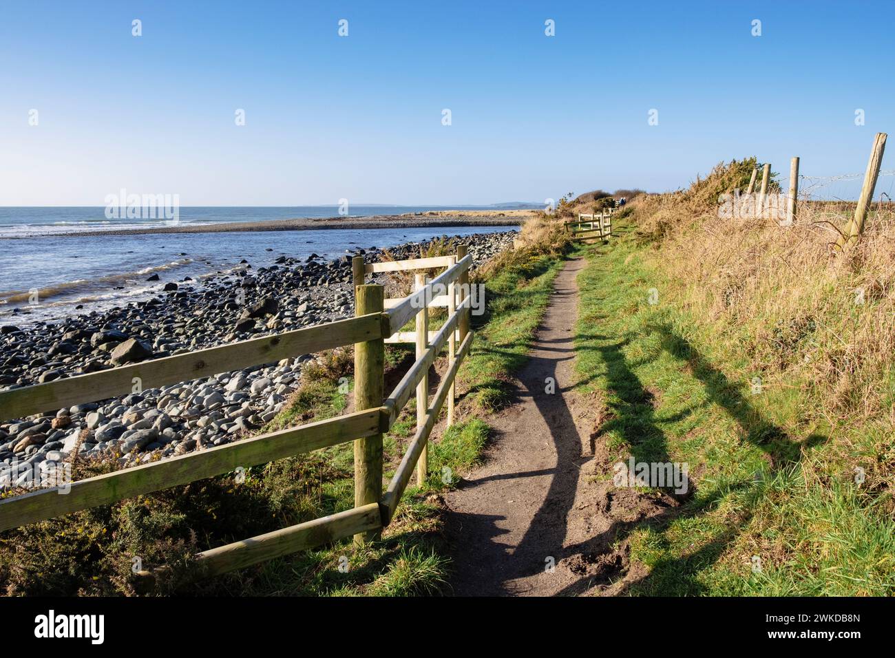 Looking west along the Wales coastal path along the coast from Criccieth, Llyn Peninsula, Gwynedd, north Wales, UK, Britain, Europe Stock Photo