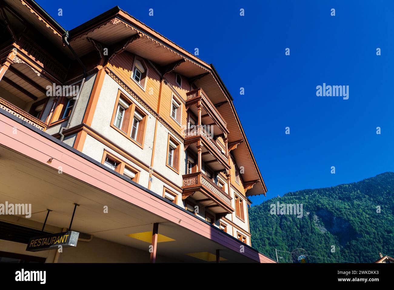 Colourful Swiss chalet in Matten bei Interlaken, Switzerland Stock Photo