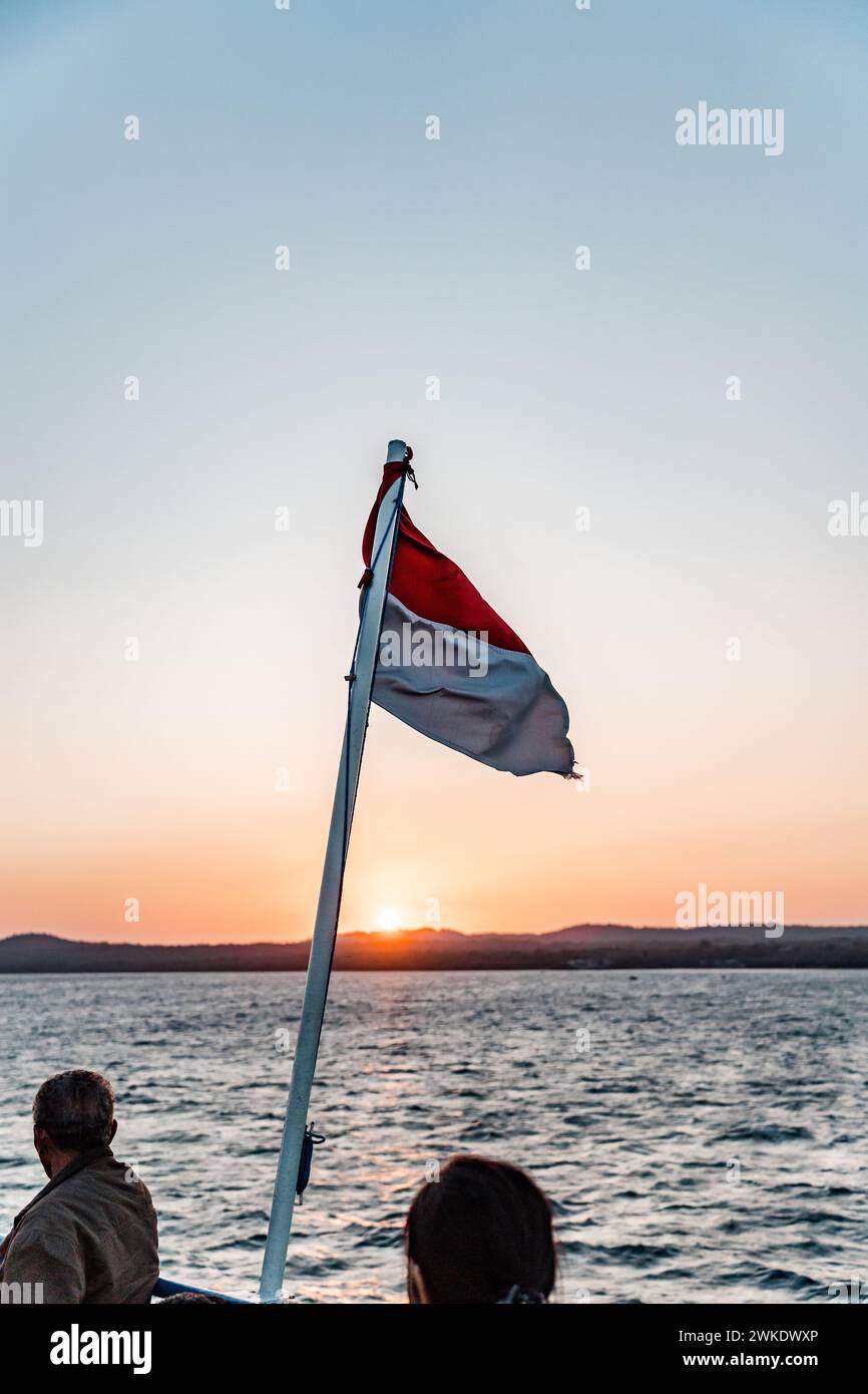 View from the ferry with Indonesian Flag, Kupang East Nusa Tenggara, Indonesia Stock Photo