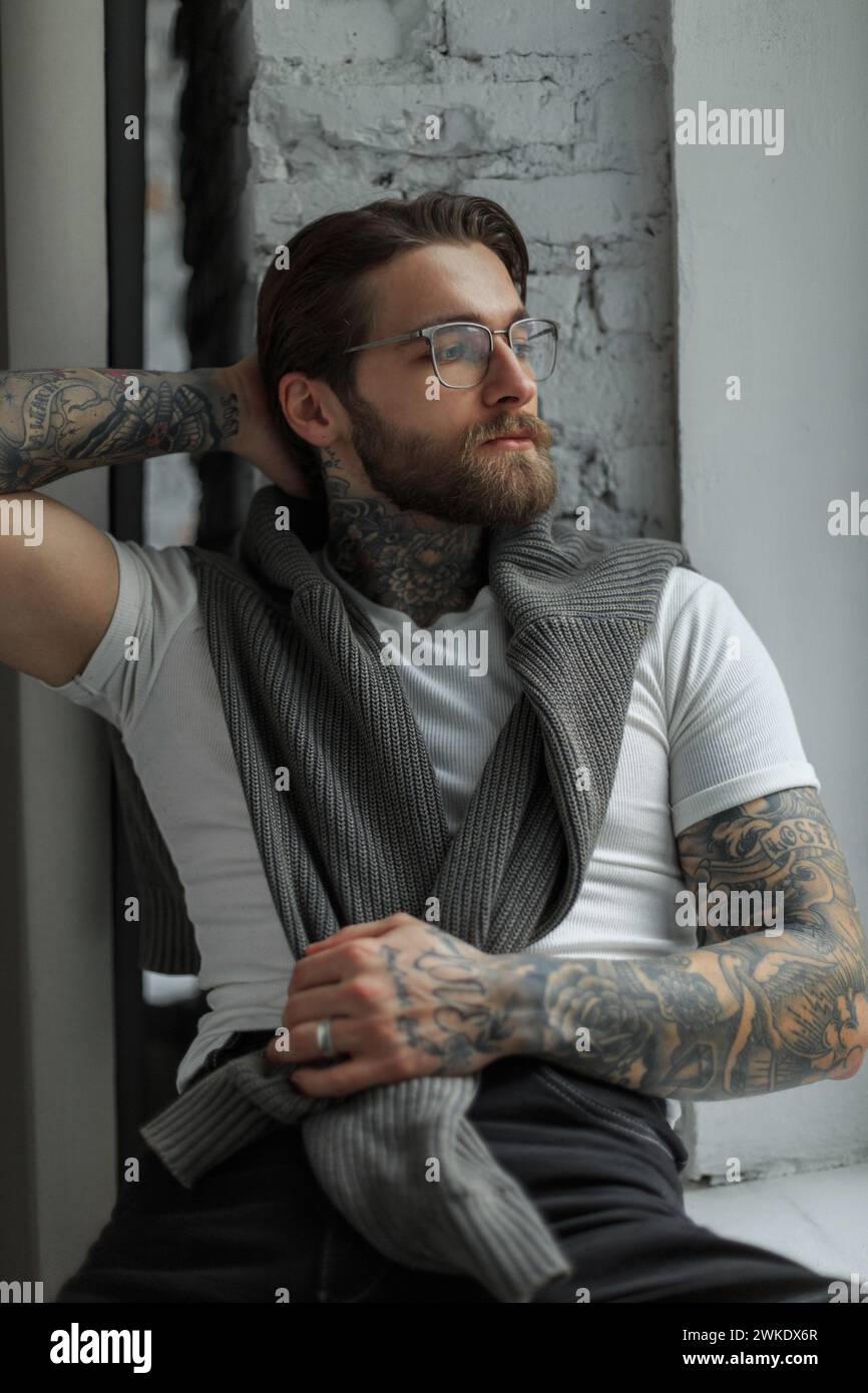 Cool Hipster Handsome Guy With A Beard And Hairstyle With A Tattoo And ...