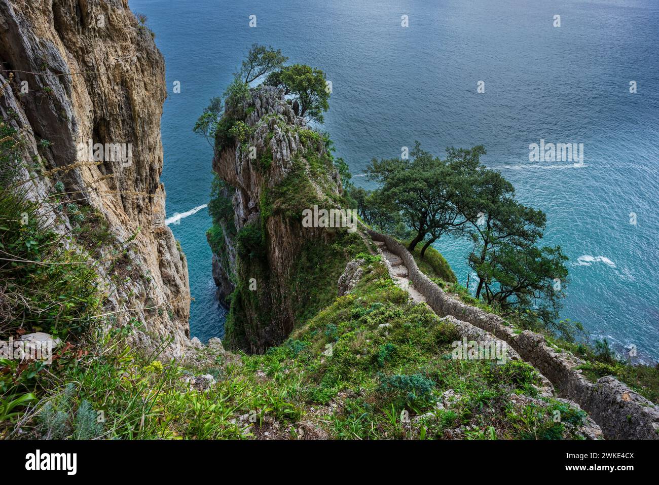 ascent of the stairs of Del Caballo lighthouse, Buciero mountain, Santoña, Cantabria, Spain. Stock Photo
