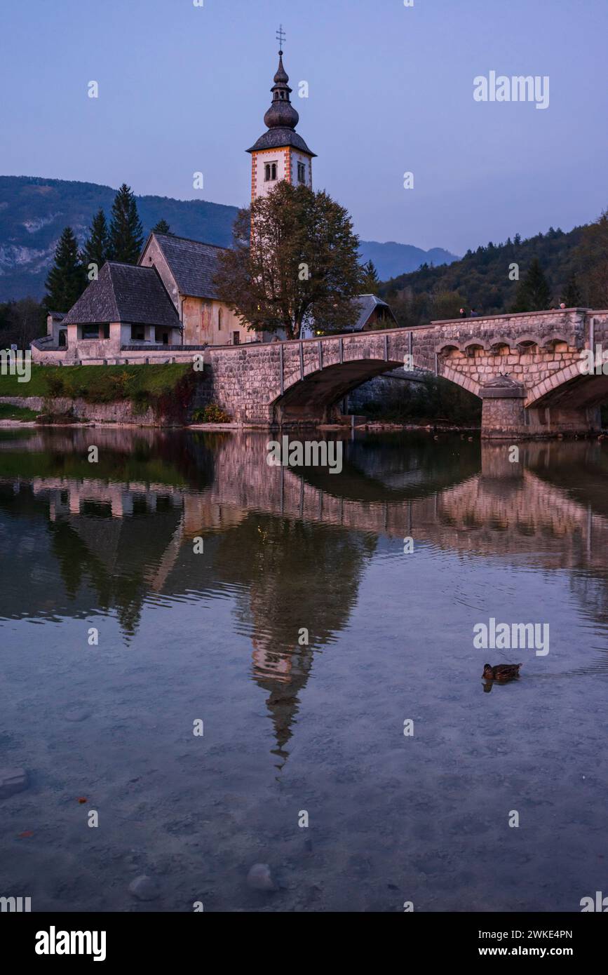 San Juan Bautista Church and Romanesque bridge. ,Lake Bohinj in Triglav National Park, julian alps, Slovenia, Central Europe,. Stock Photo