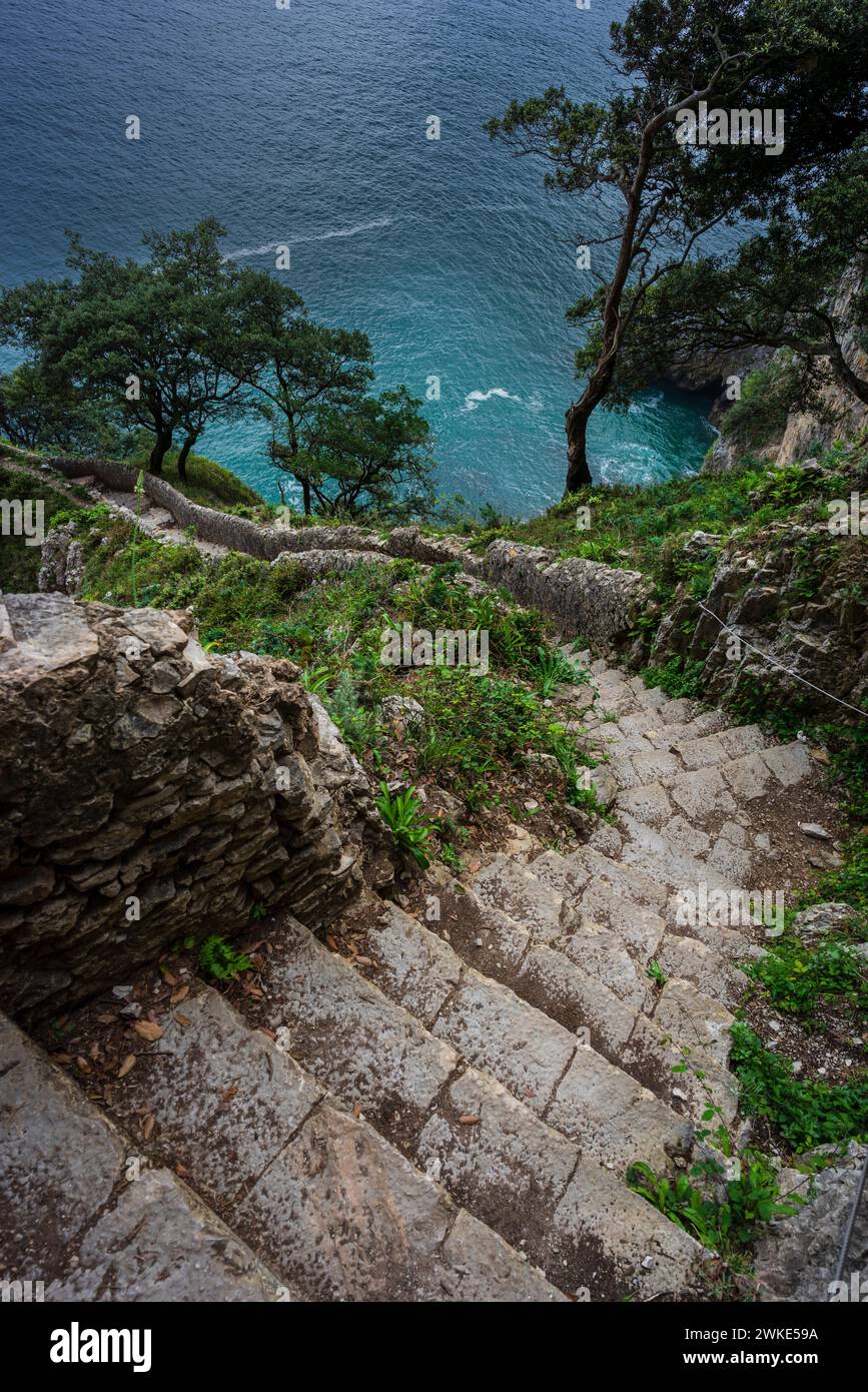 ascent of the stairs of Del Caballo lighthouse, Buciero mountain, Santoña, Cantabria, Spain. Stock Photo