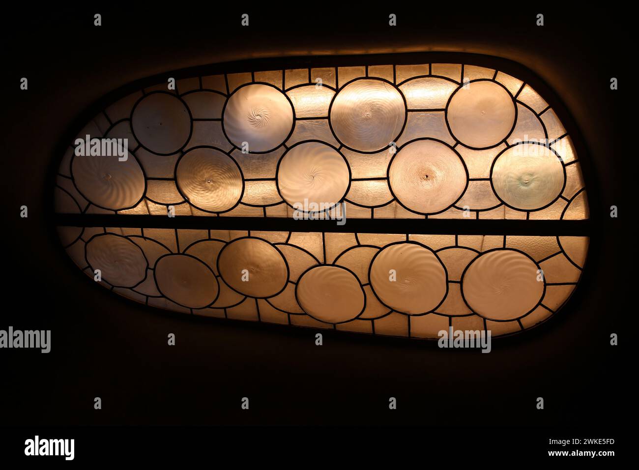 Spain. Barcelona. Casa Batlló. Remodel by Gaudí, 1904-1906. Stained glass. Stock Photo