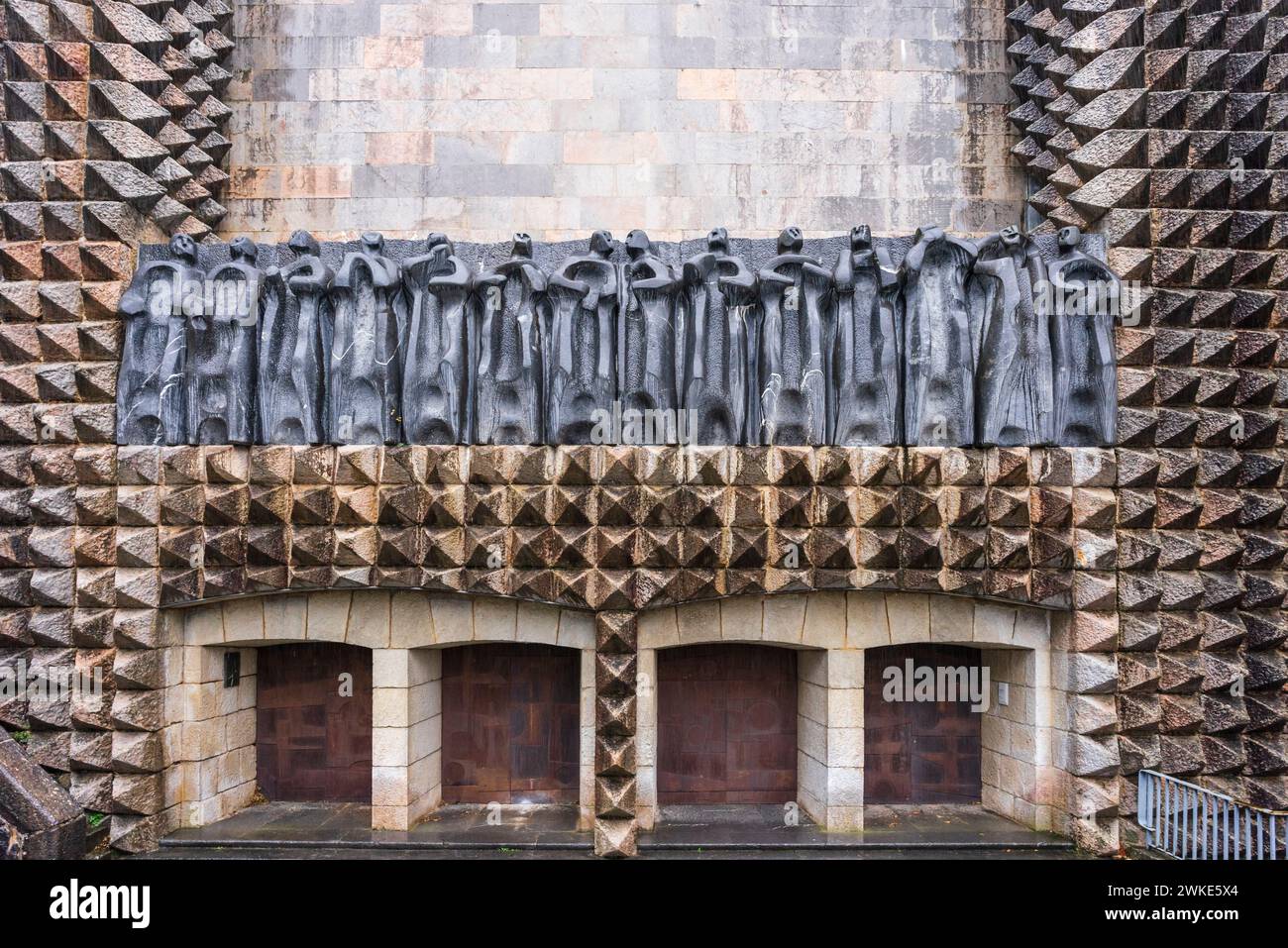 sculptures of the 14 apostles on the façade, sculptor Jorge Oteiza, and iron doors by Eduardo Chillida, Arantzazu Sanctuary, municipality of Oñati, , Basque Country, Spain. Stock Photo