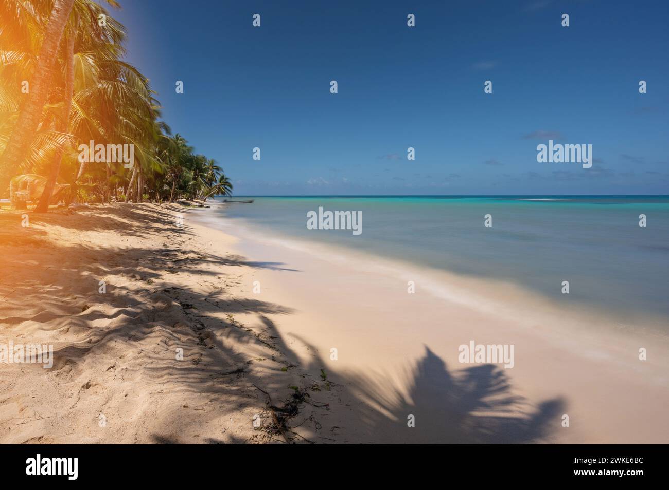 Caribbean travel background. Empty beach with smooth clear blue water Stock Photo