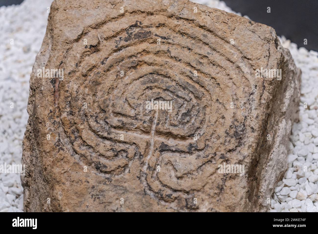 Labyrinth stele, 8th-11th centuries, Labyrinth engraved in stone, path of perfection for salvation, Romanesque church of San Pantaleón, Museum of prehistory and archeology (MUPAC), Santander, Cantabria, Spain. Stock Photo