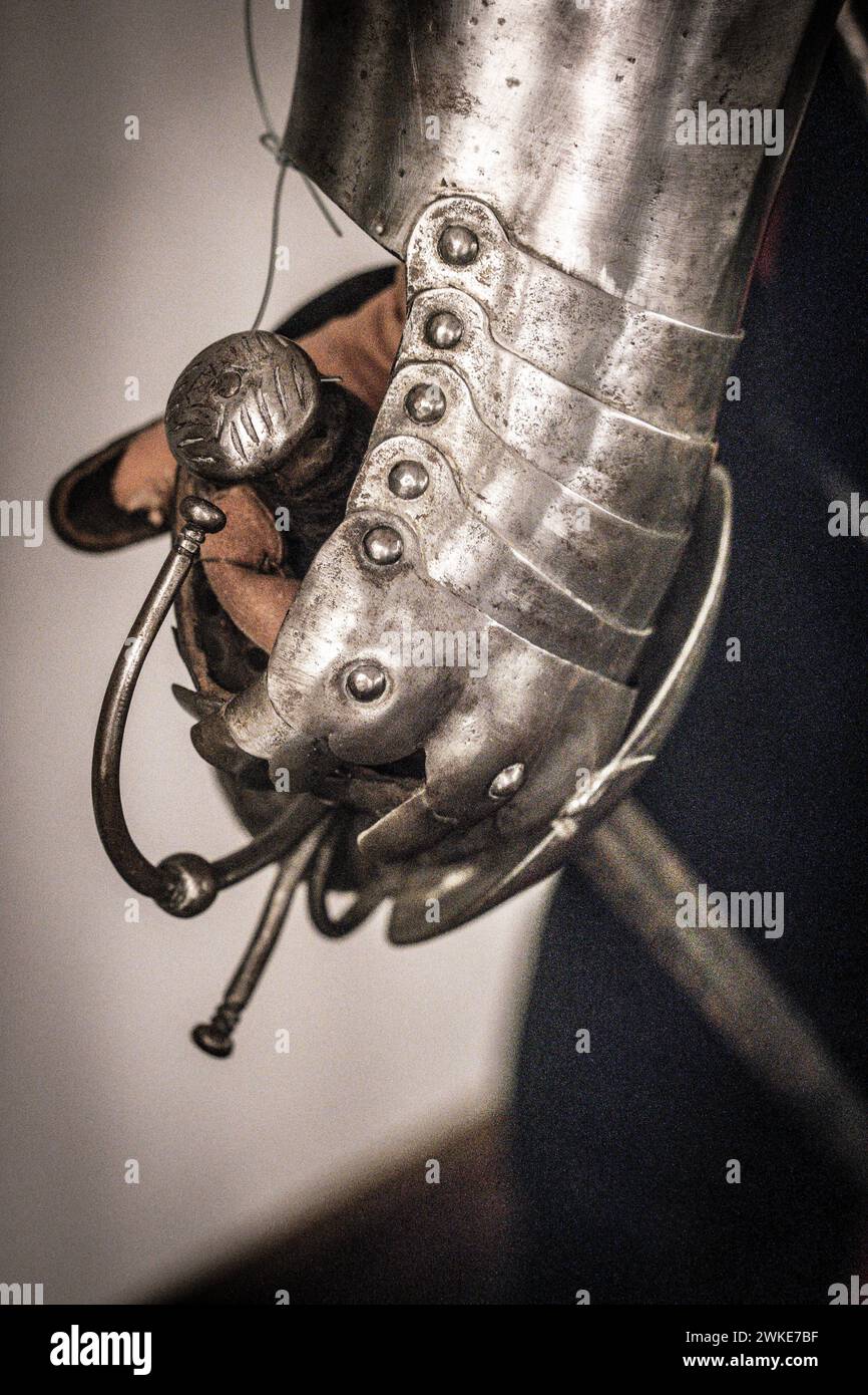 armor gauntlet wielding a sword, 16th century, Álava Armory Museum, Vitoria, Basque Country, Spain. Stock Photo