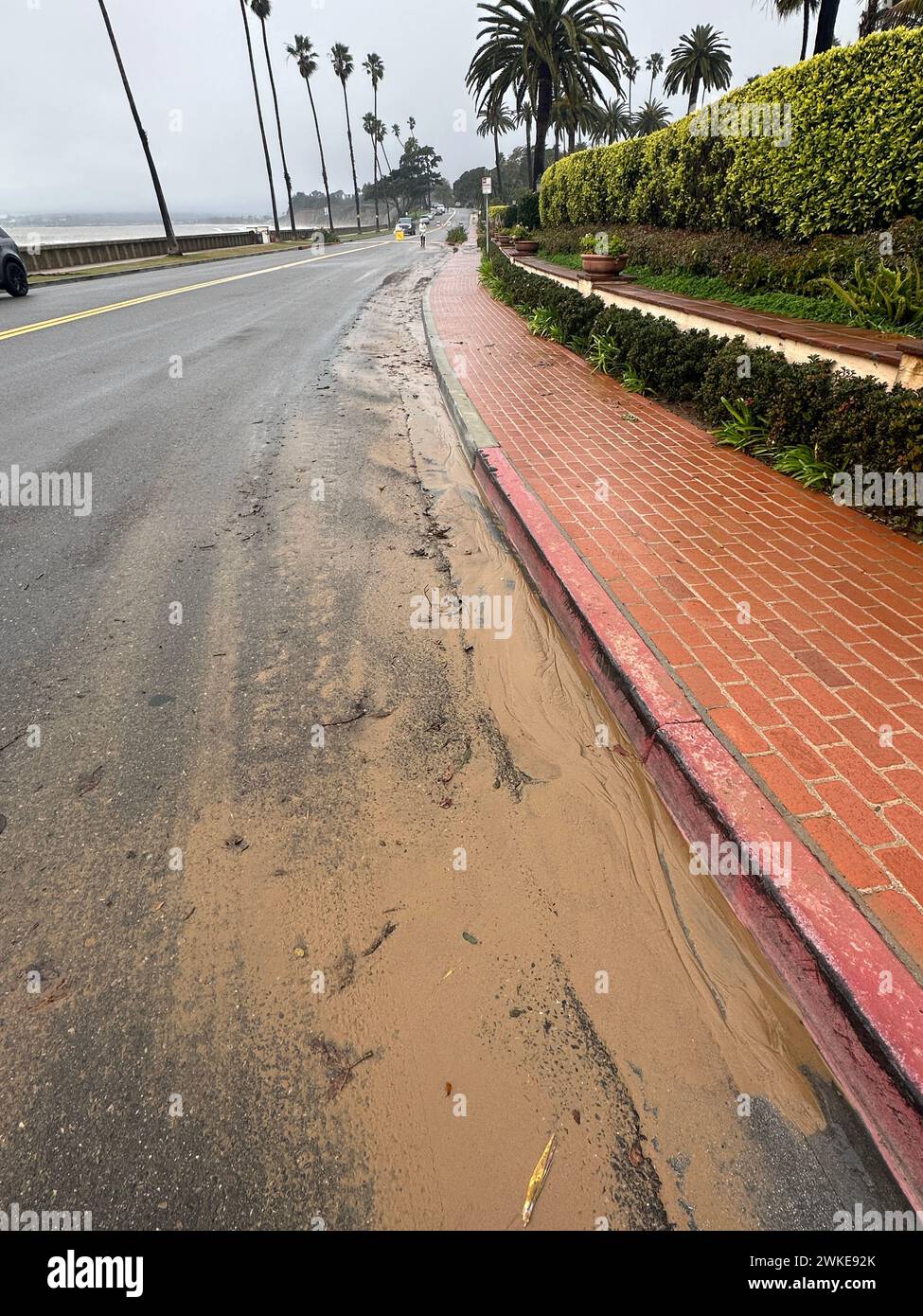 Montecito, California, USA. 19th Feb, 2024. A muddy street following flooding on Feb. 19, 2024: Butterfly Lane at Butterfly Beach was shut down on February 19 for several due to flooding and high tides throwing rocks on the street. (Credit Image: © Amy Katz/ZUMA Press Wire) EDITORIAL USAGE ONLY! Not for Commercial USAGE! Stock Photo