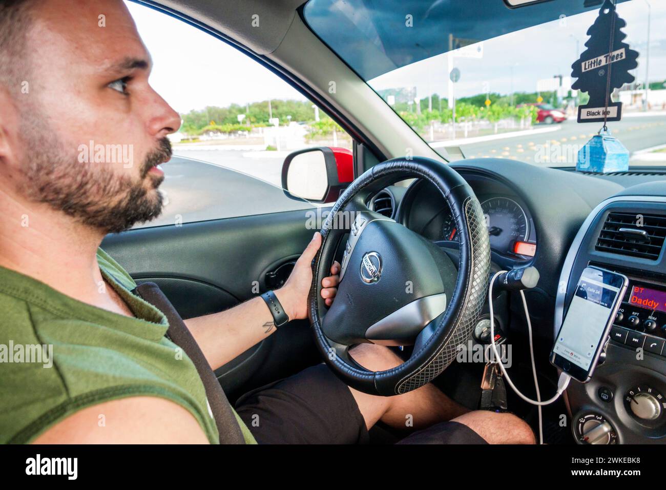 Merida Mexico,Xcumpich Calle 20A,Uber driver,man men male,adult adults,resident residents,driving,inside interior,car vehicle,mobile cell phone app,su Stock Photo