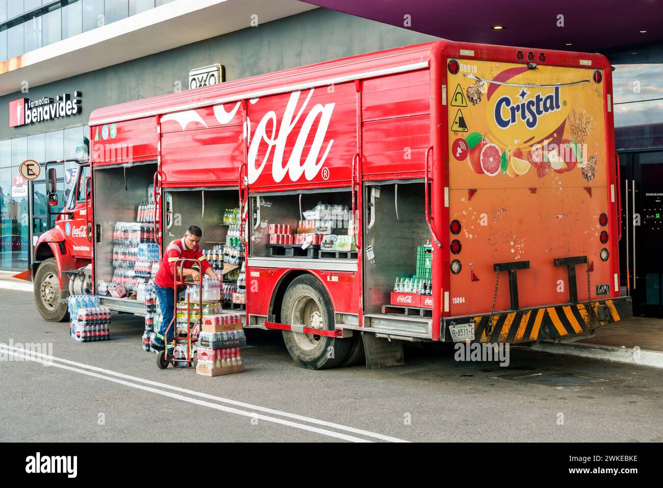 Merida Mexico,Zona Industrial,Galerias Merida shopping mall,outside exterior,Coke Cocca-Cola delivery truck,man men male,adult adults,resident residen Stock Photo