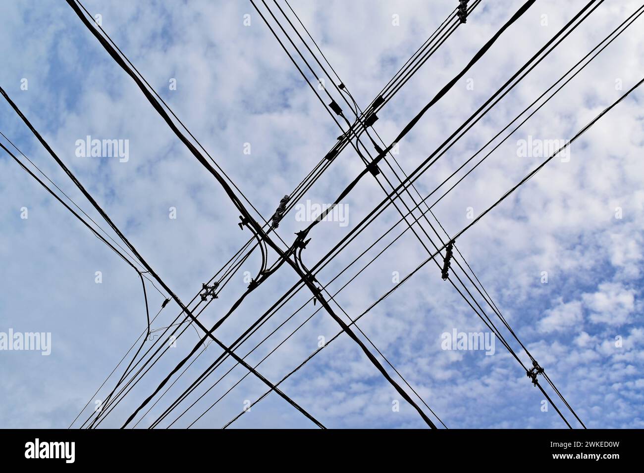 Electrical wires crossing and blue sky in Ribeirao Preto, Sao Paulo, Brazil Stock Photo