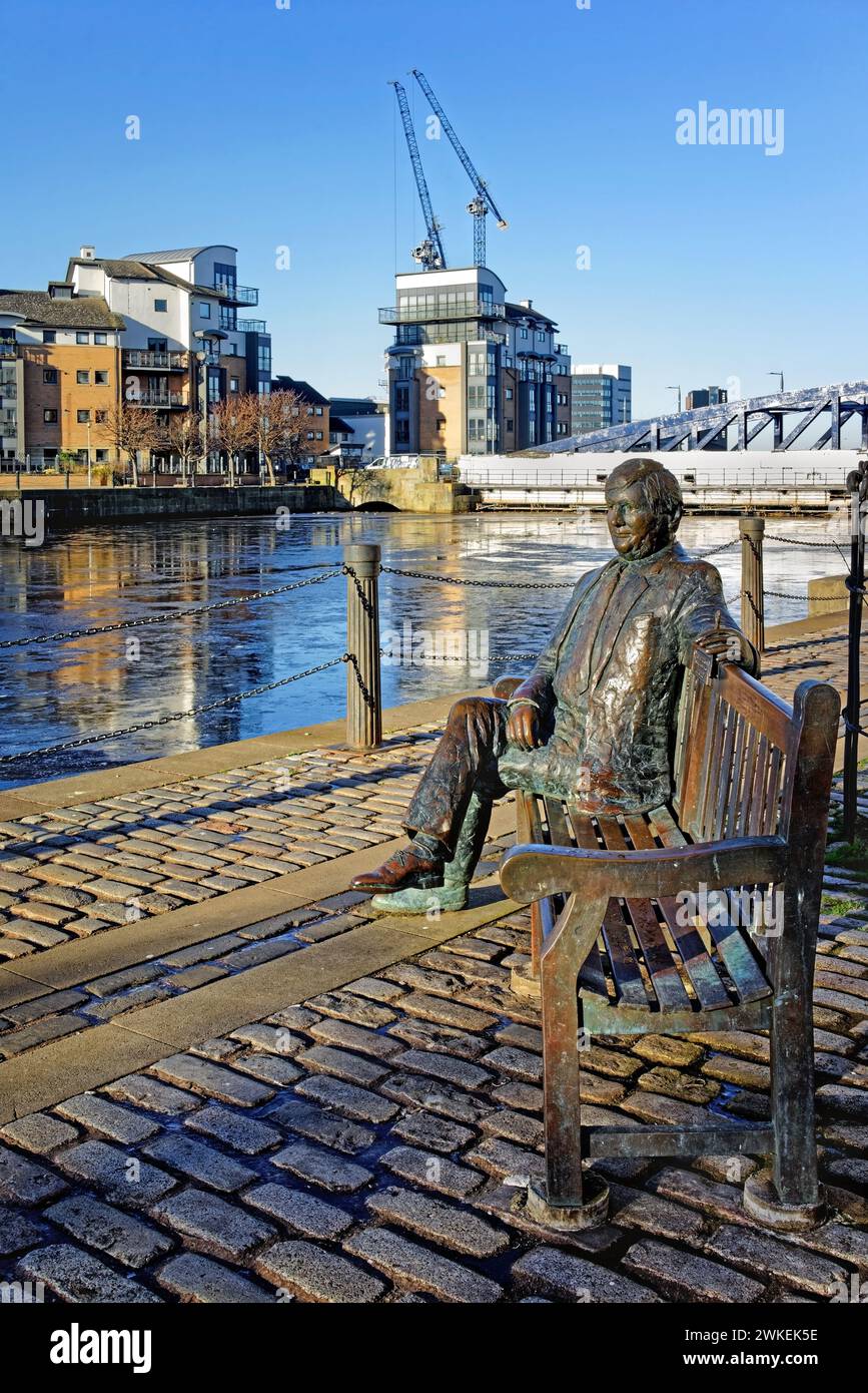 UK, Scotland, Edinburgh, Leith, The Shore, Sandy Irvine Robertson Statue, Water of Leith and Port of Leith Docks. Stock Photo