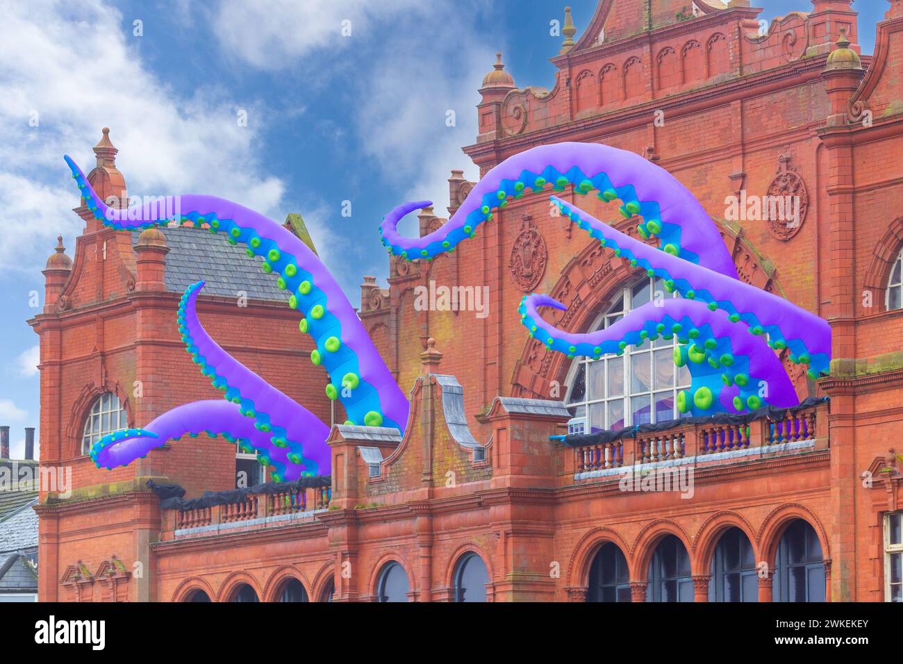 Giant octopus tentacles emerging from the Morecambe Winter Gardens for Morecambe Baylight 2024 festival, Lancashire, England Stock Photo