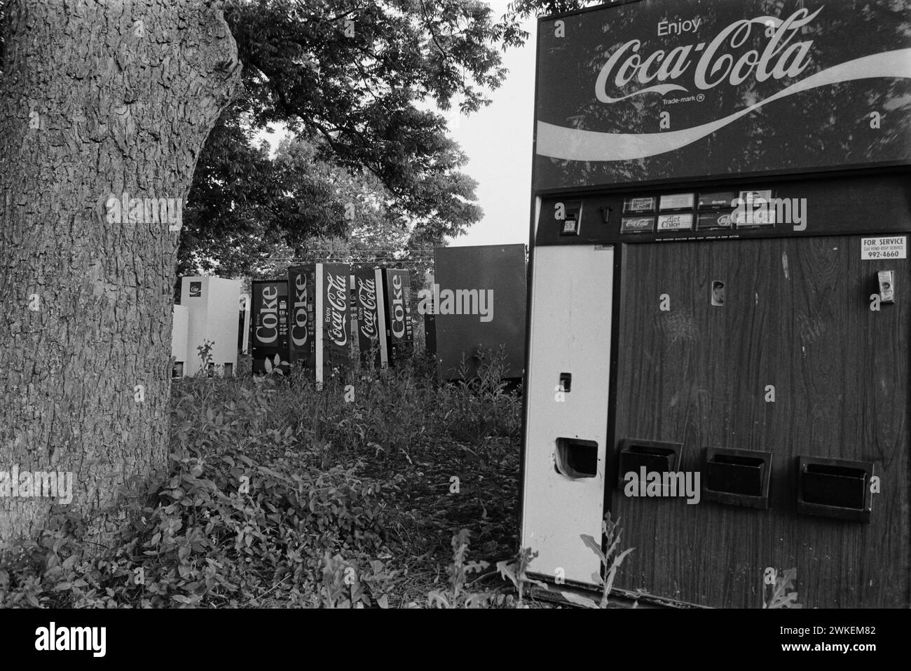 Coca-Cola vendng machines abandonded on wasteland in Georgia in the 1980s. Stock Photo