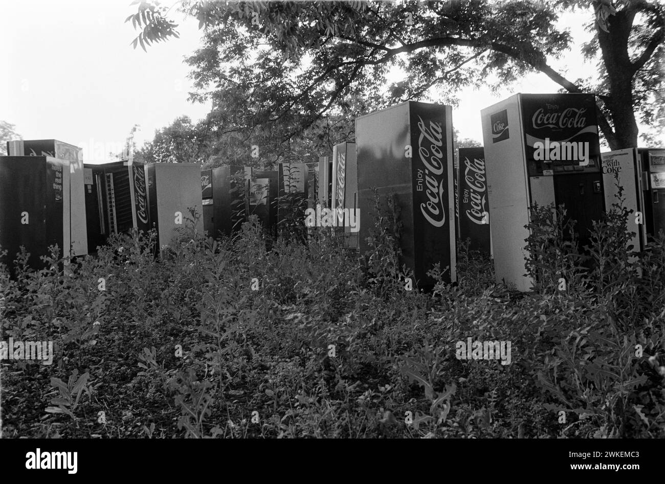 Coca-Cola vendng machines abandonded on wasteland in Georgia in the 1980s. Stock Photo