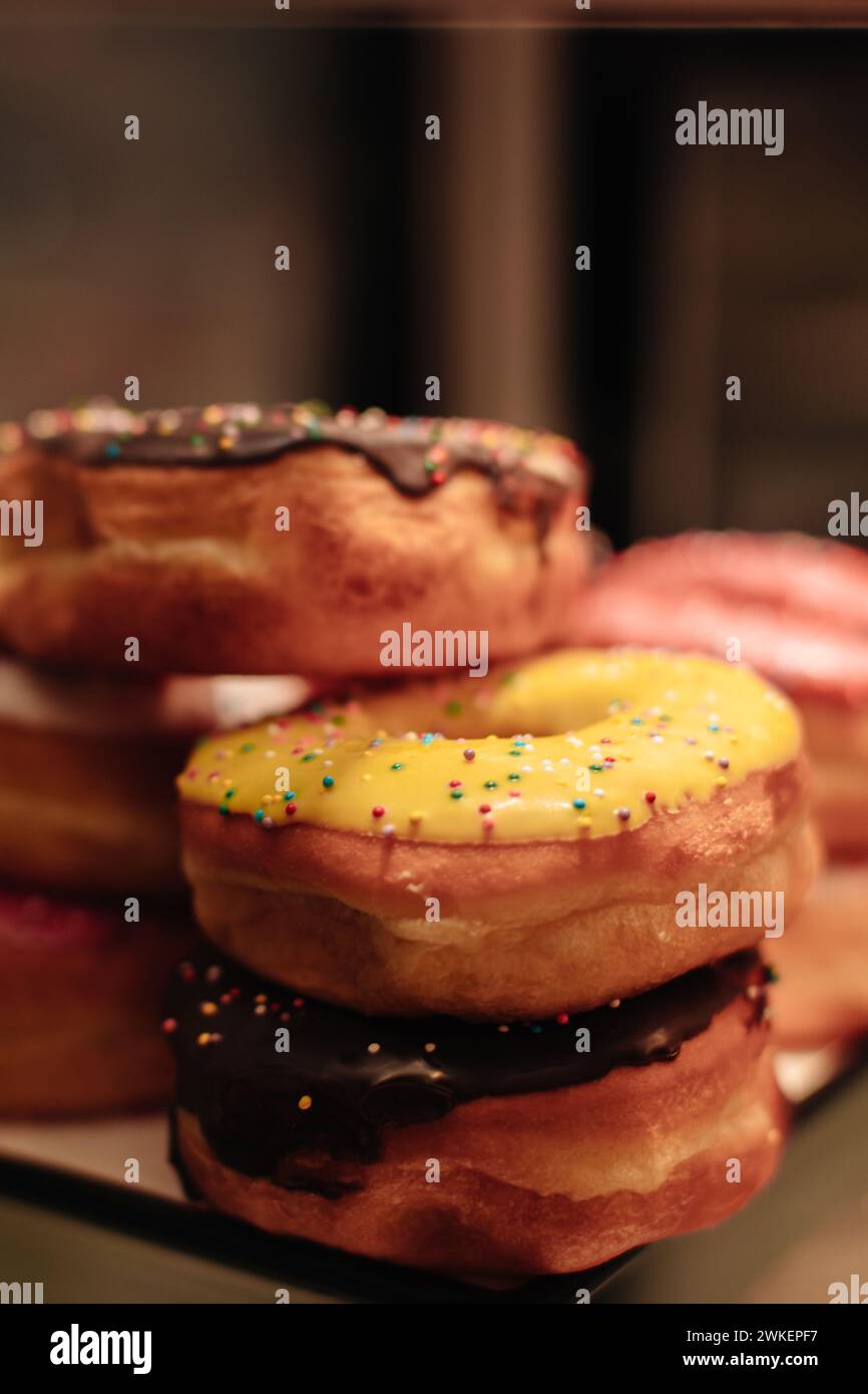 Colorful sweet freshly baked donuts with creamy topping Stock Photo - Alamy