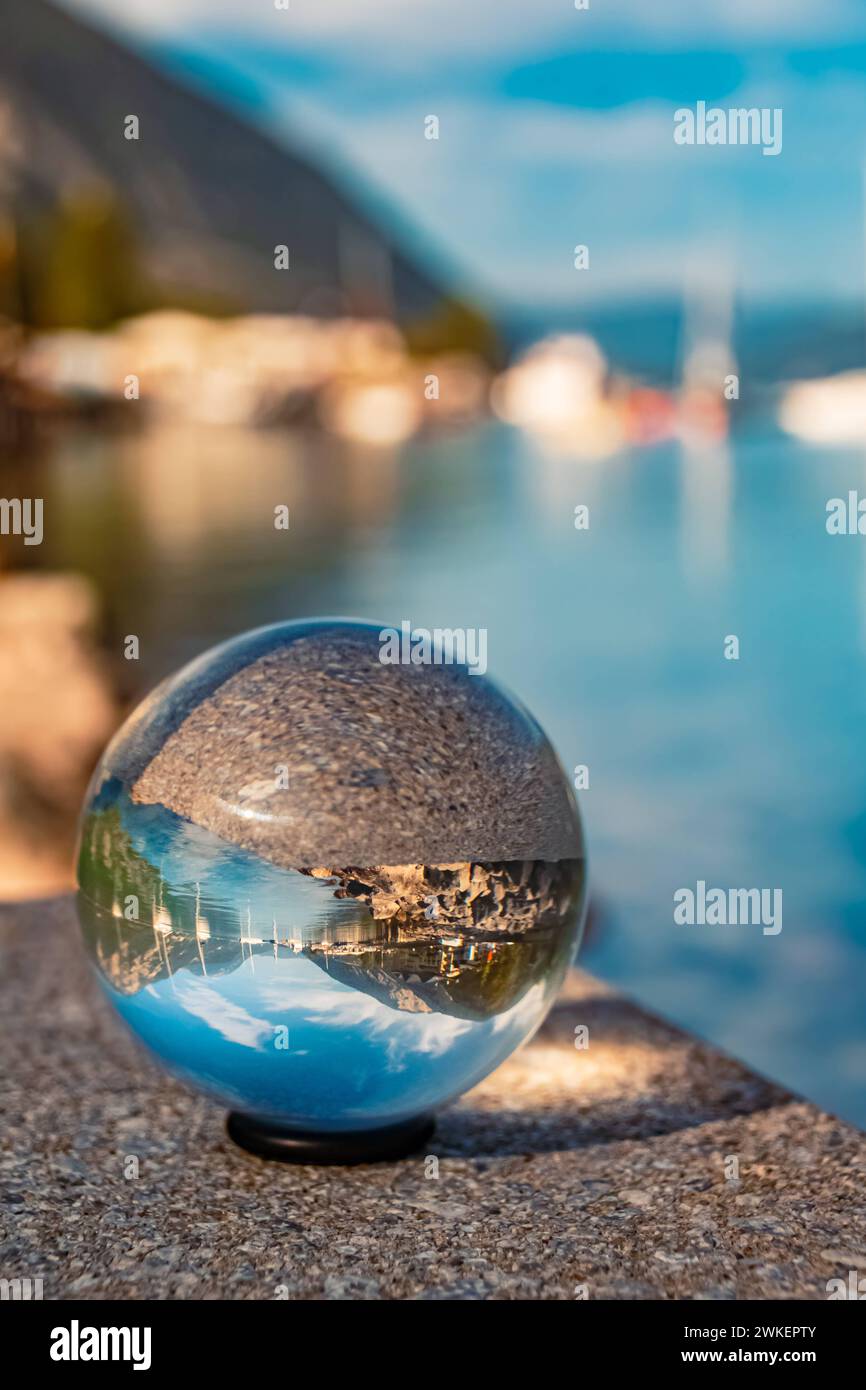 Crystal ball alpine autumn or indian summer landscape shot with boats and reflections at Lake Achensee, Pertisau, Eben am Achensee, Tyrol, Austria Ach Stock Photo