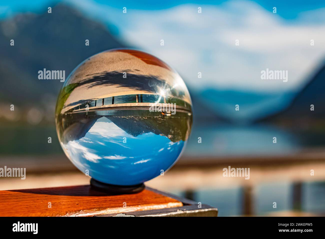 Crystal ball alpine autumn or indian summer landscape shot with boats and reflections at Lake Achensee, Pertisau, Eben am Achensee, Tyrol, Austria Ach Stock Photo