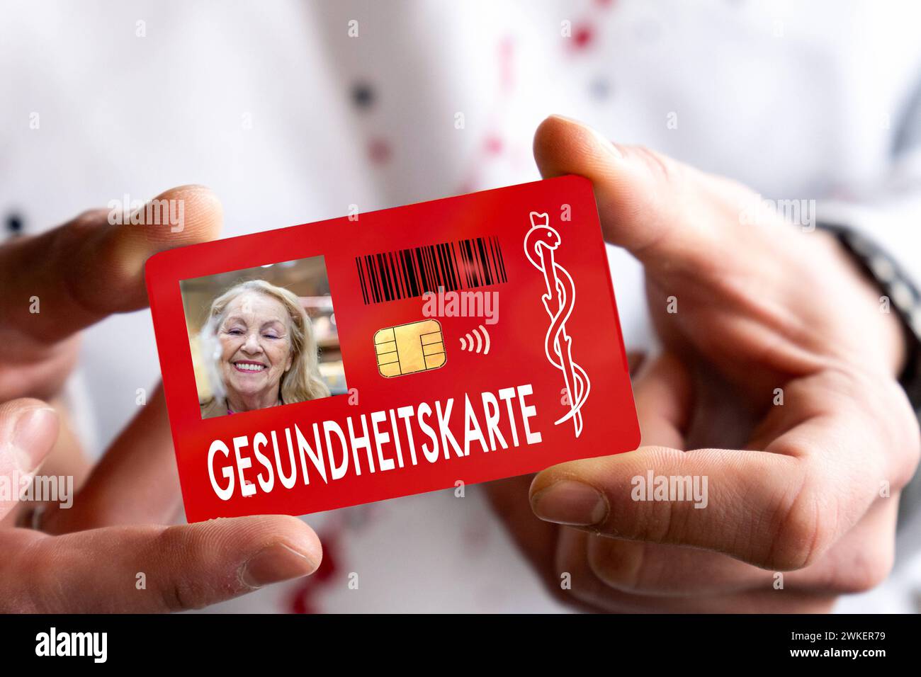 February 20, 2024: Person holding an eGK electronic health card from the health insurance company, the card has an RFID chip. PHOTOMONTAGE *** Person hält eine eGK elektronische Gesundheitskarte der Gesundheitskasse in der Hand, die Karte hat einen RFID-Chip. FOTOMONTAGE Stock Photo