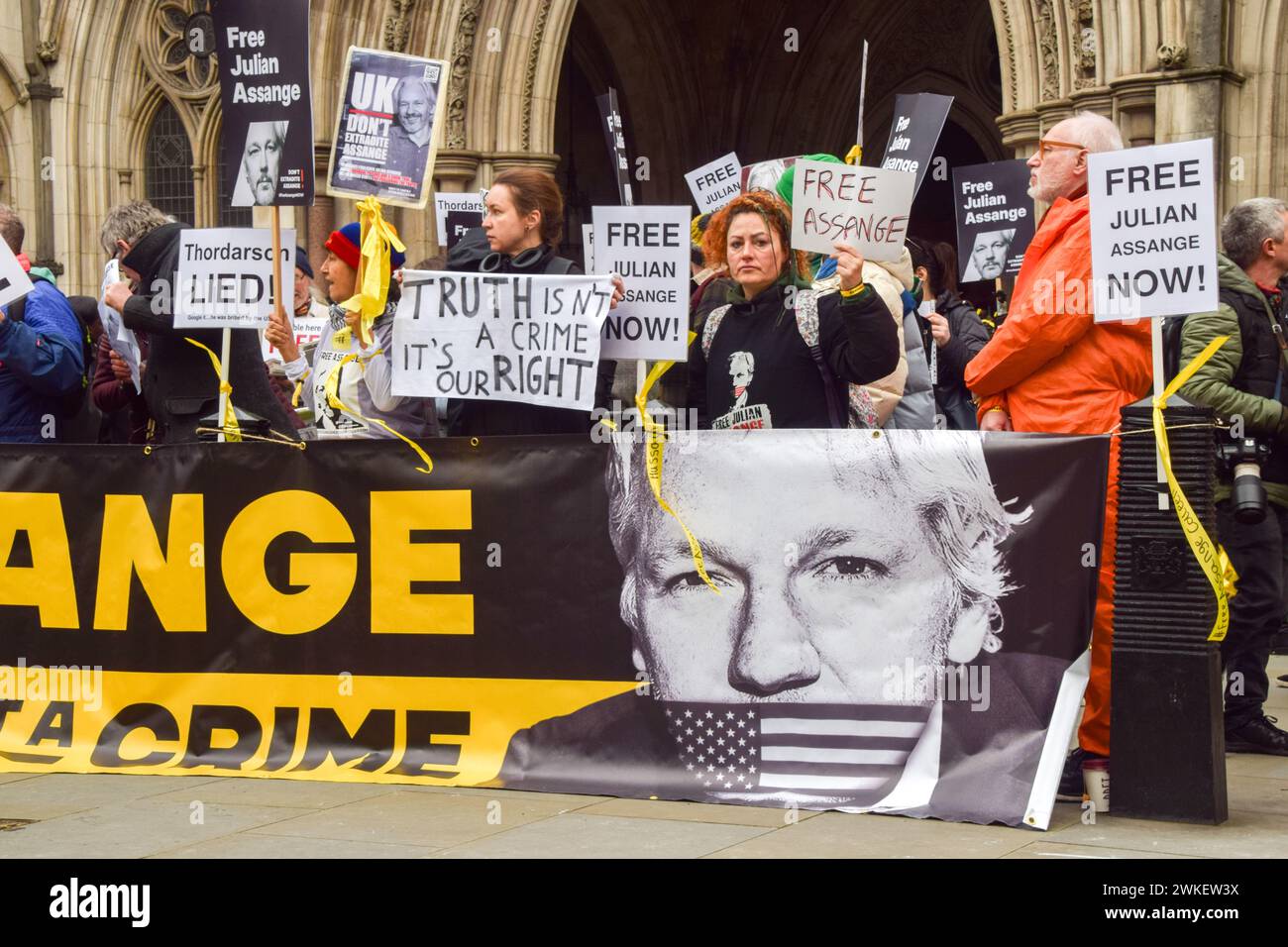 London, UK. 20th Feb, 2024. Protesters hold placards in support of