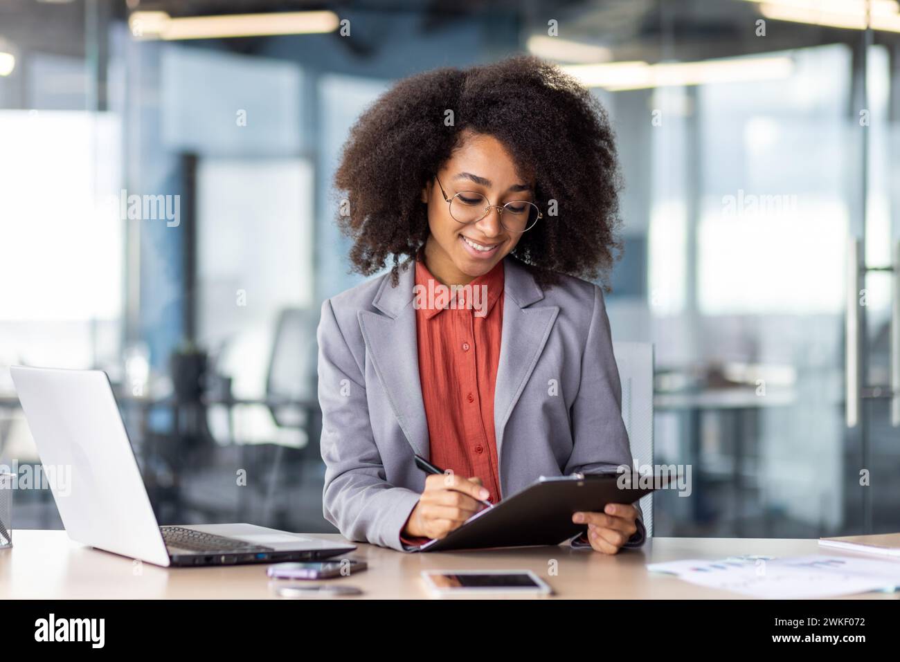 Woman marking checklist tasks hi-res stock photography and images - Alamy