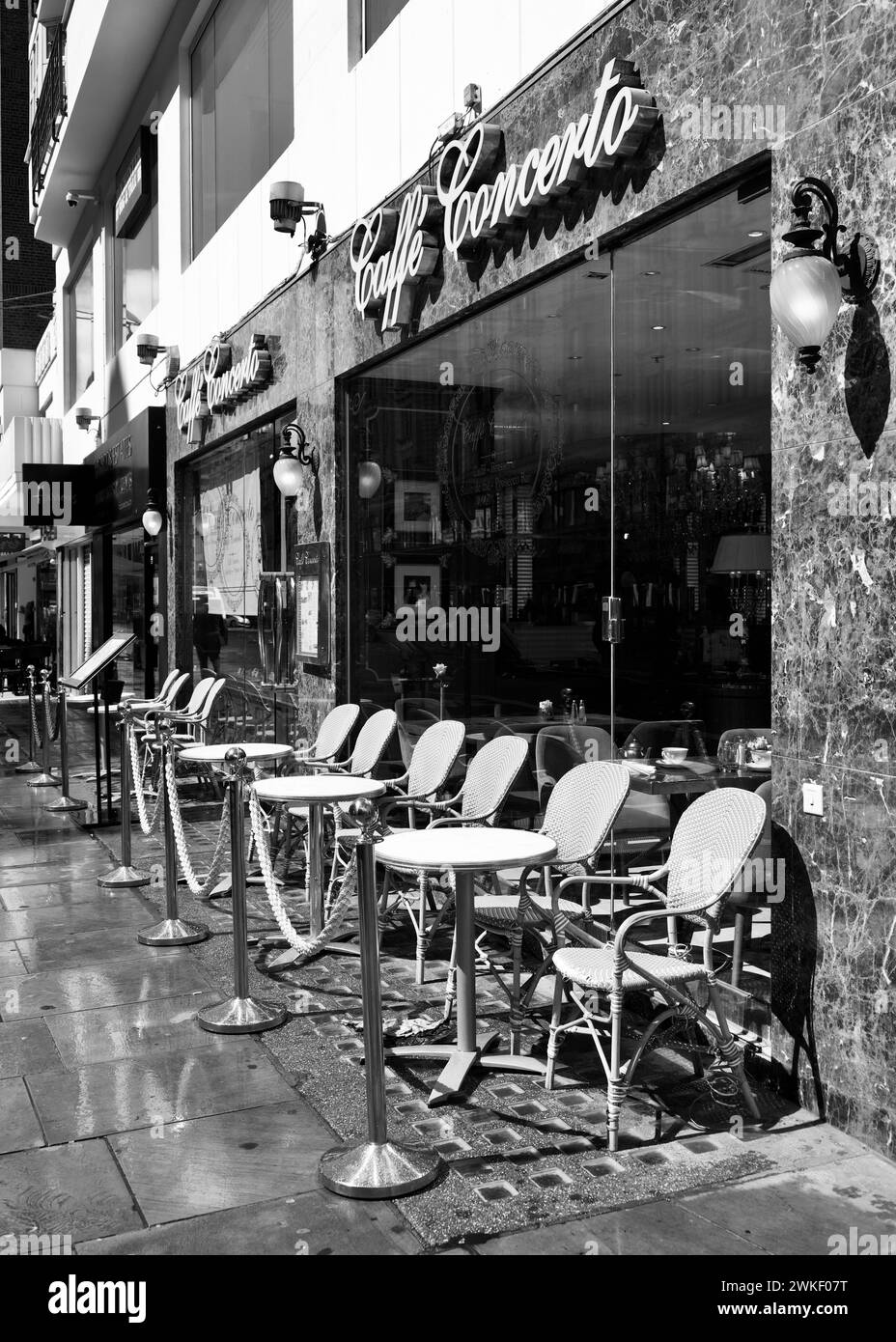 Taken early in the morning on Kensington High Street just sat the cafe was setting up. Stock Photo