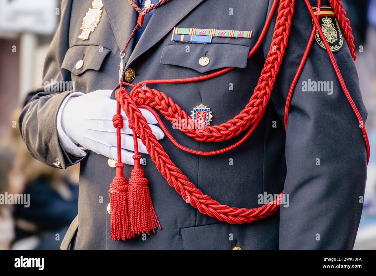 Valladolid, Spain, April 6th 2023: A solemn moment: Detail of an officer’s uniform during Valladolid’s Holy Week Procession Stock Photo