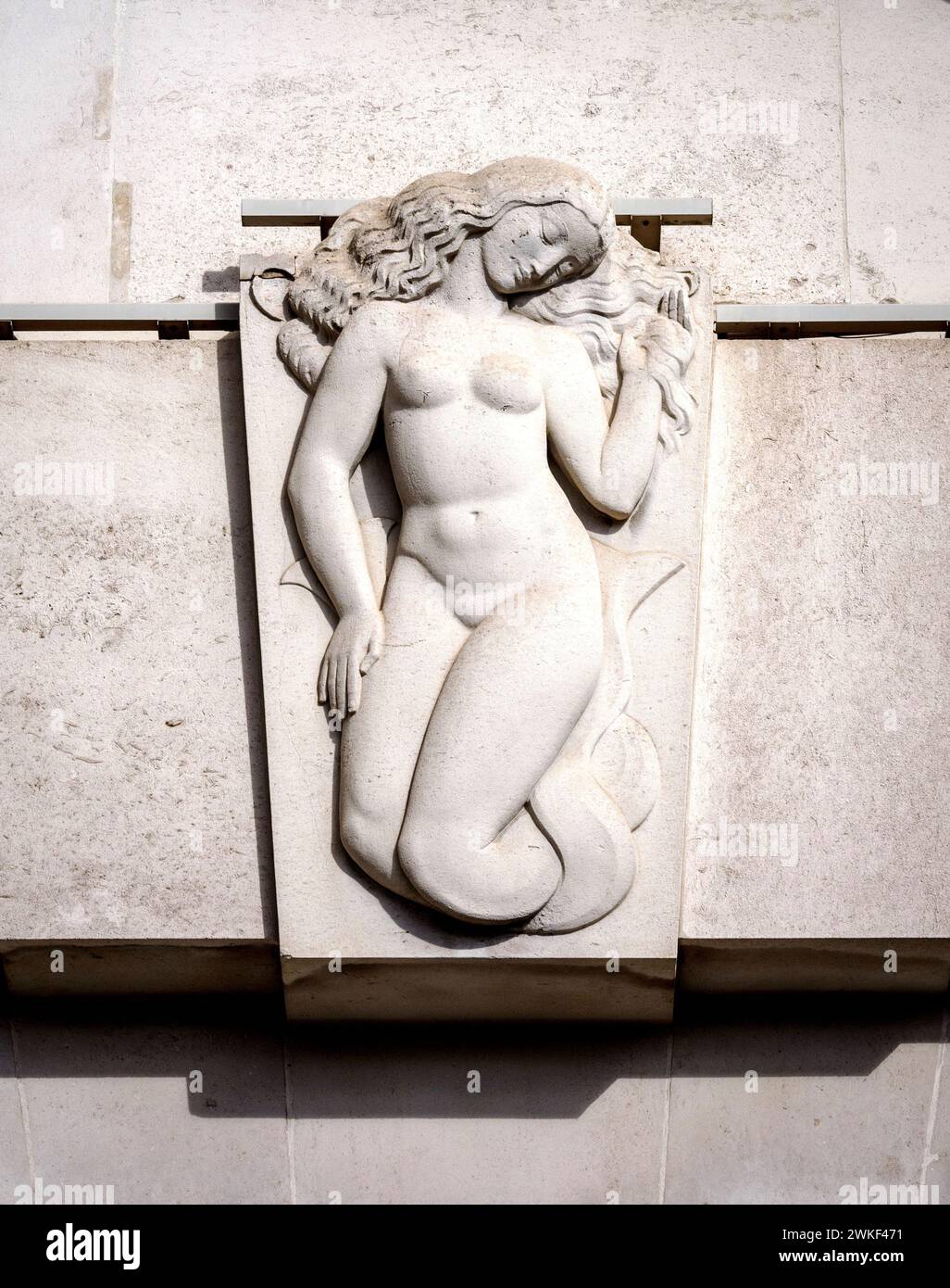 Mermaid sculpture above a portico on Unilever House a Neoclassical Art Deco building facing Blackfriars Bridge in London UK by Gilbert Ledward Stock Photo