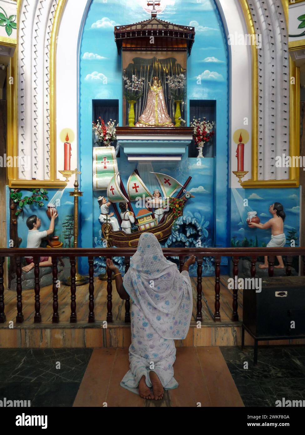 India kerala kollam indian woman praying at the church of our lady