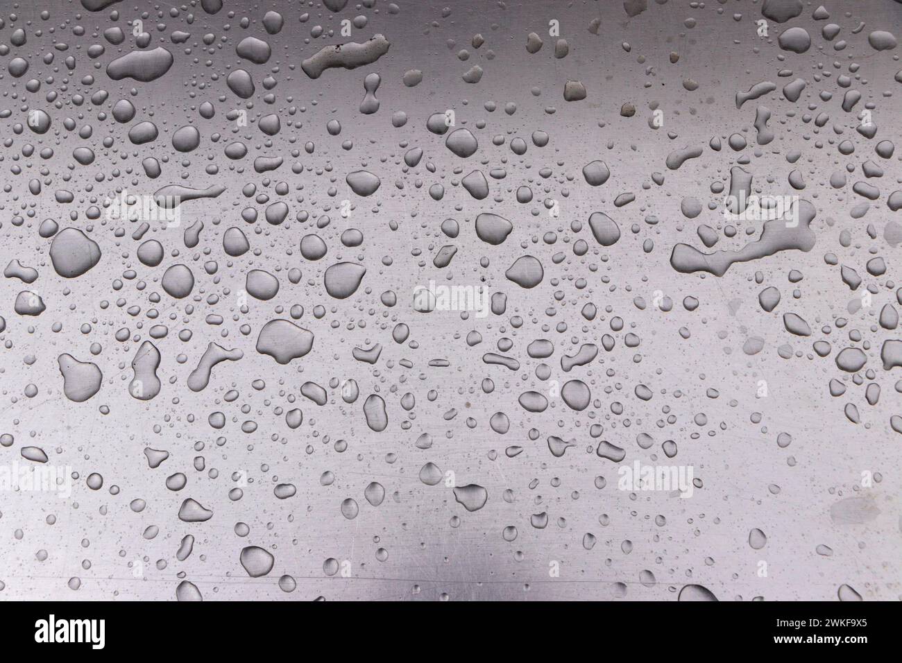 abstract background of raindrops on metal seat surface Stock Photo