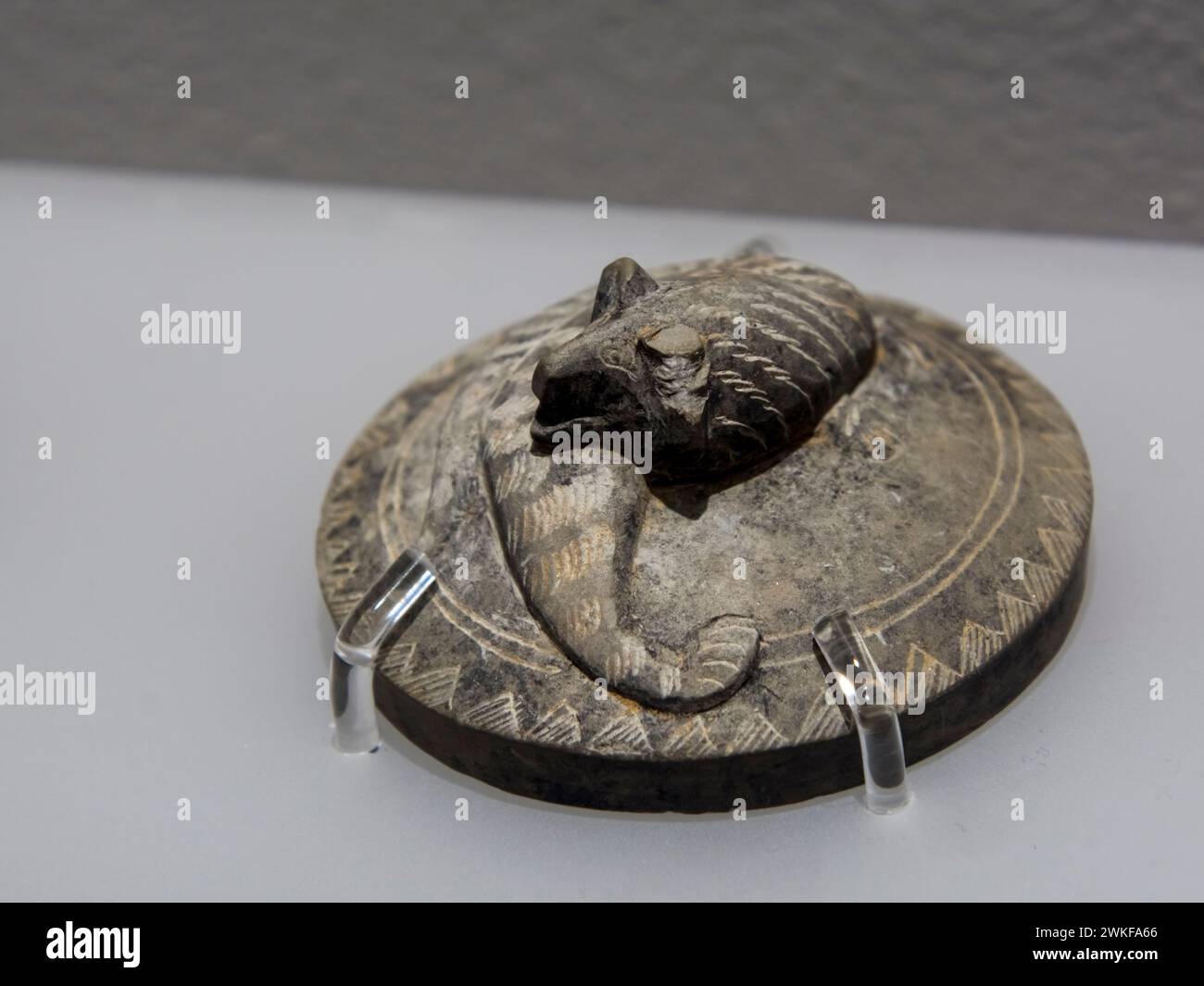 SZEGED, HUNGARY - SEPTEMBER 10. 2023: Tripod inkstone and lid with a couchant tiger in the Chinese exhibition in the Mora Ferenc Museum in Szeged Stock Photo