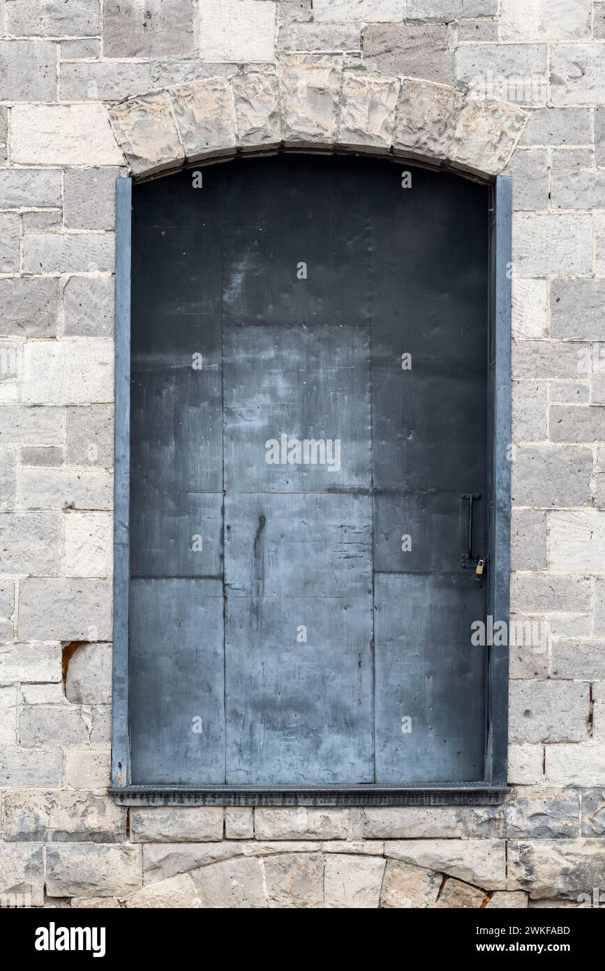 Metal door on the historic Ryder Brothers Warehouse in Baker City, Oregon. Stock Photo