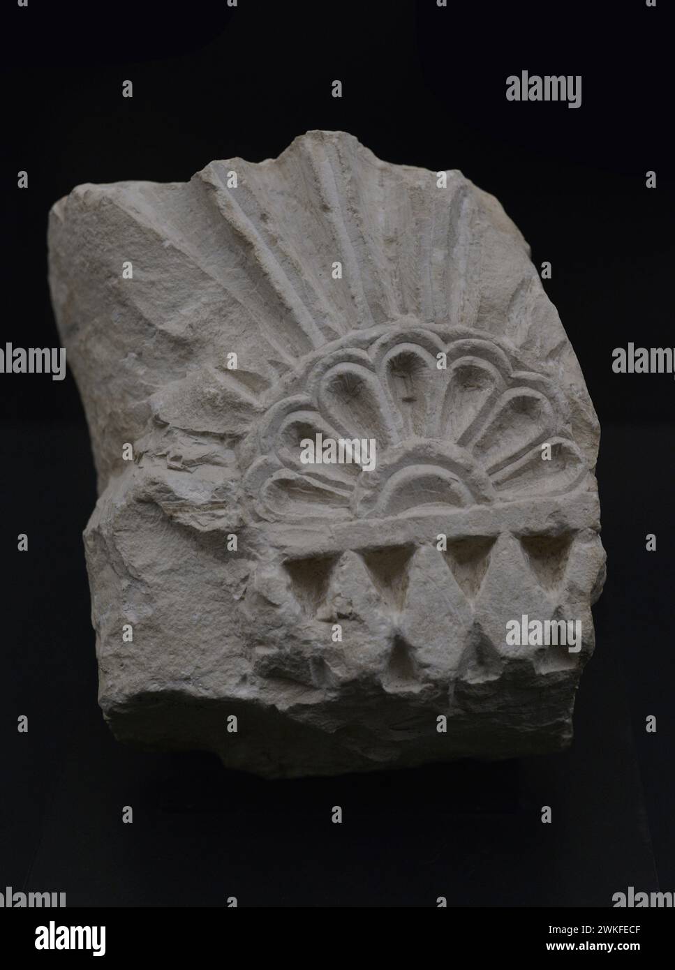 Fragment of a niche plate with bevelled decoration, scallop on a gadrooned hinge line. Limestone. 7th century. From the Cigarral del Aserradero, Toledo, Spain. Museum of Visigoth Councils and Culture. Toledo, Castile-La Mancha, Spain. Stock Photo