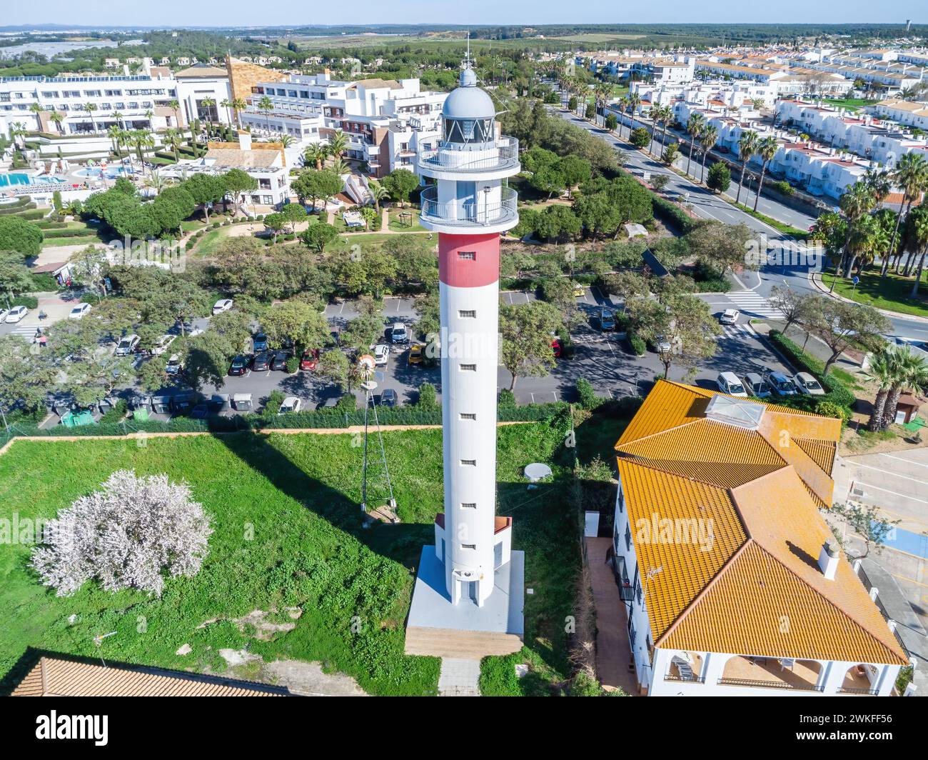 Aerial view of Lighthouse tower in the beach village El Rompido, in the municipality of Cartaya, Huelva, Andalusia, Spain. This lighthouse dates back Stock Photo