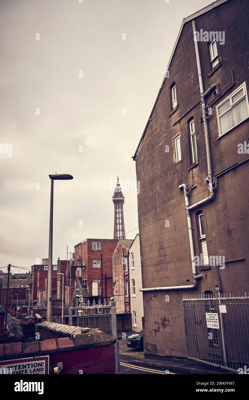 Blackpool tower seen behing alleyway and backs of hotels Stock Photo