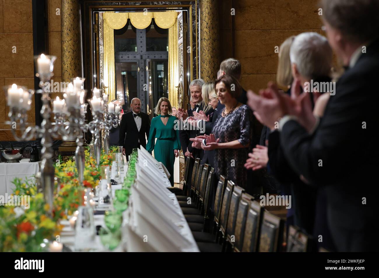 Hamburg, Germany. 20th Feb, 2024. Guests of honor Kaja Kallas, Prime Minister of the Republic of Estonia (back, 2nd from left), and Federal Chancellor Olaf Scholz (SPD, left) arrive at the Great Banquet Hall in City Hall for the traditional Matthiae meal of the Hamburg Senate. The Matthiae banquet is considered to be the oldest banquet still celebrated in the world. Credit: Christian Charisius/dpa/Alamy Live News Stock Photo