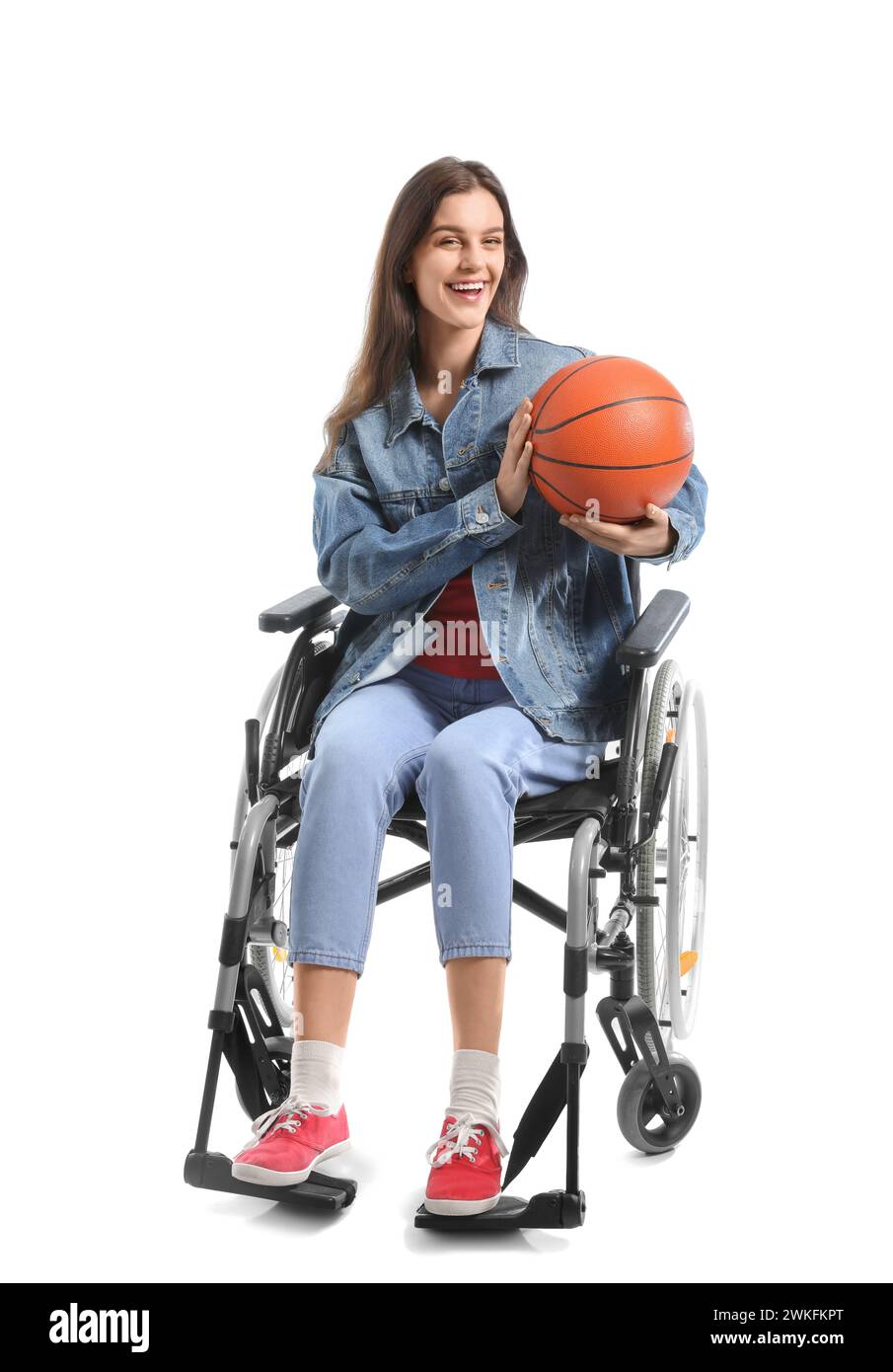 Young woman in wheelchair with ball on white background Stock Photo - Alamy