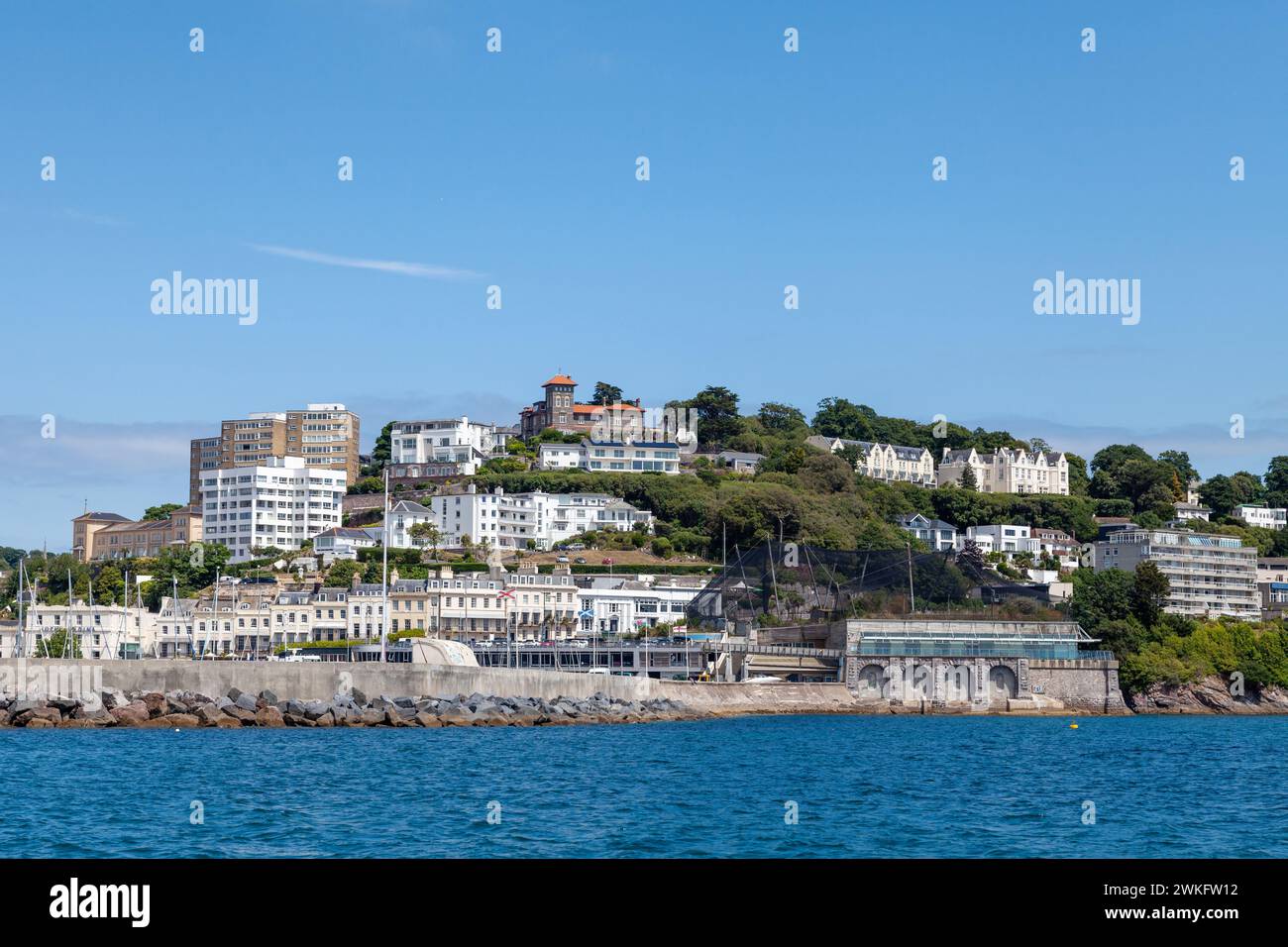 The seafront in Torquay seen from a boat on a summers day Stock Photo