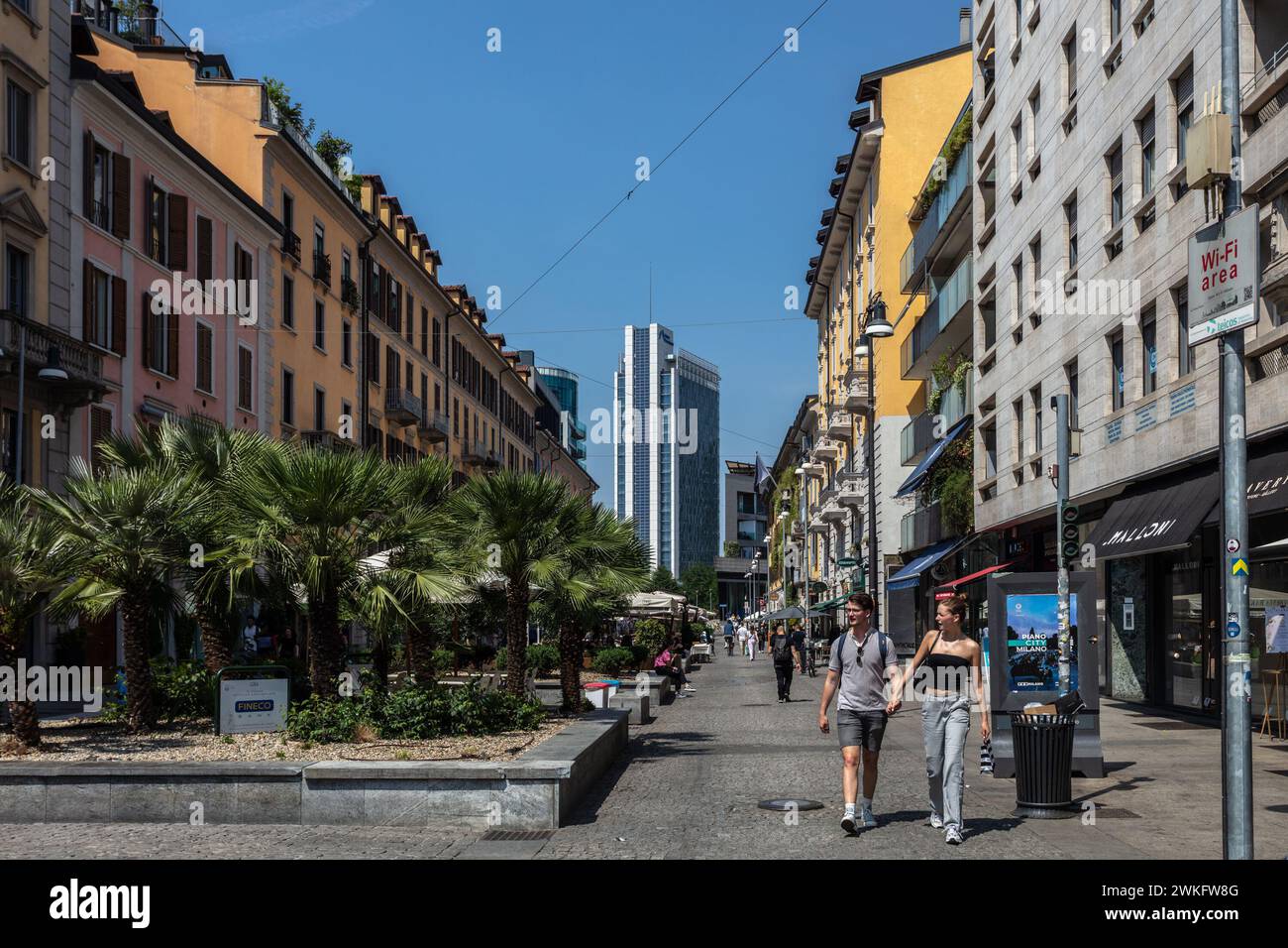 Corso Como in Milan, a lively shopping street with restaurants and shops selling fashion, art and design. The Garibaldi tower can be seen at the back. Stock Photo