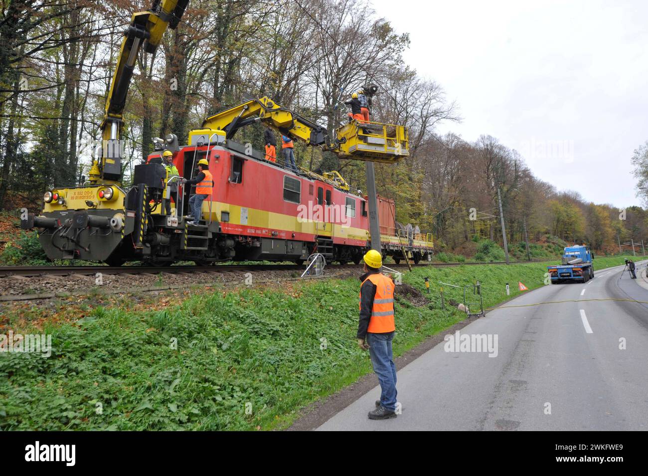 repair of the overhead contact line at the railroad tracks repair of the overhead contact line Stock Photo