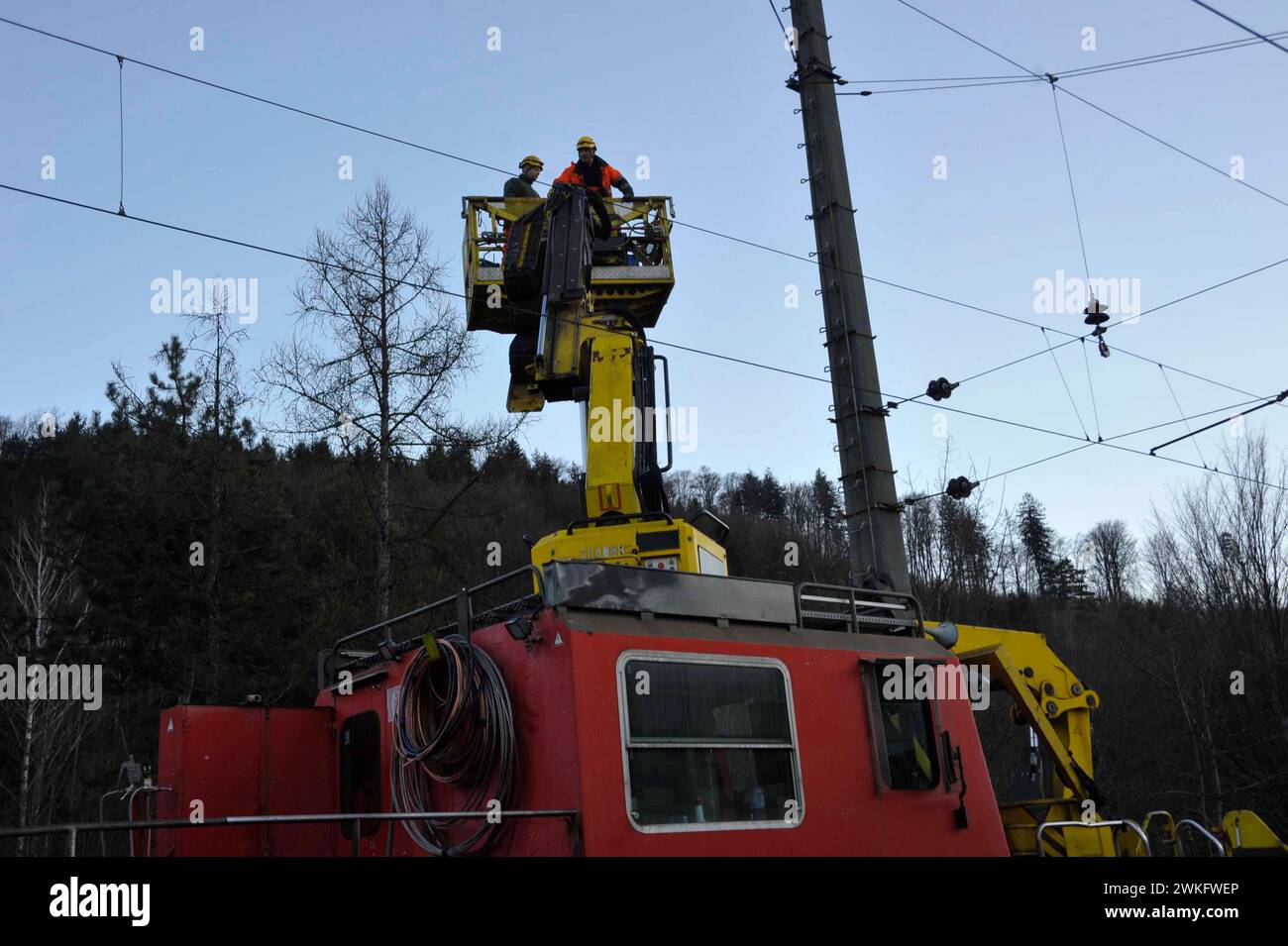 repair of the overhead contact line at the railroad tracks repair of the overhead contact line Stock Photo