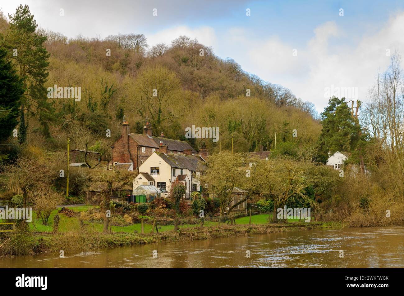 Houses on the banks of the River Severn on a sunny winter day, Ironbridge, Shropshire, England Stock Photo
