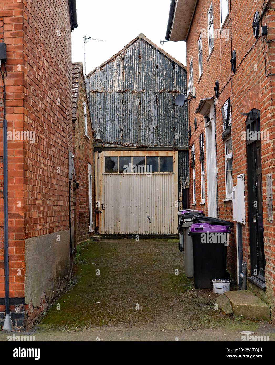 Which came first? the houses or this old garage with a big cream door